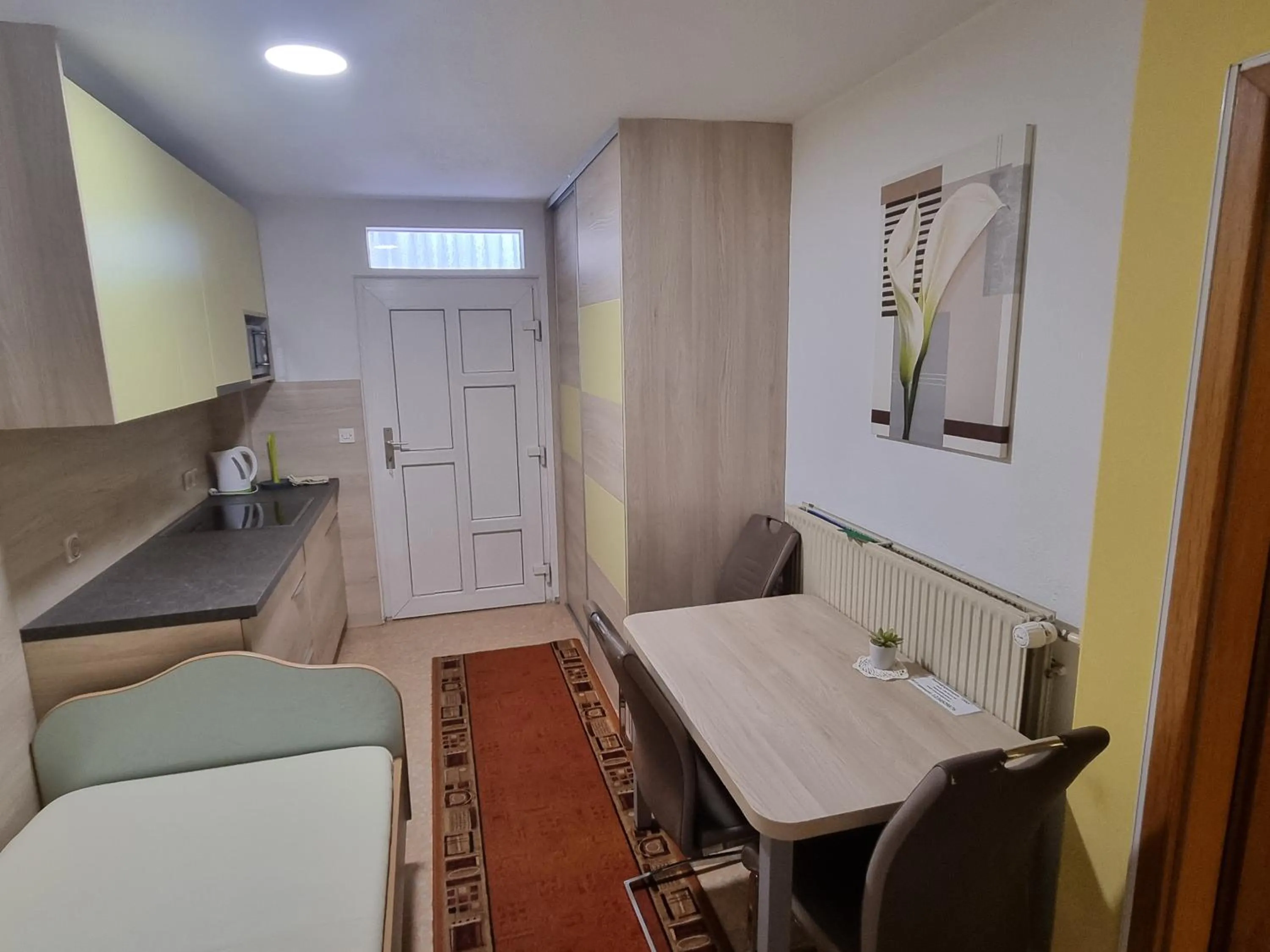 Kitchen or kitchenette in Rooms & Apartments Jana