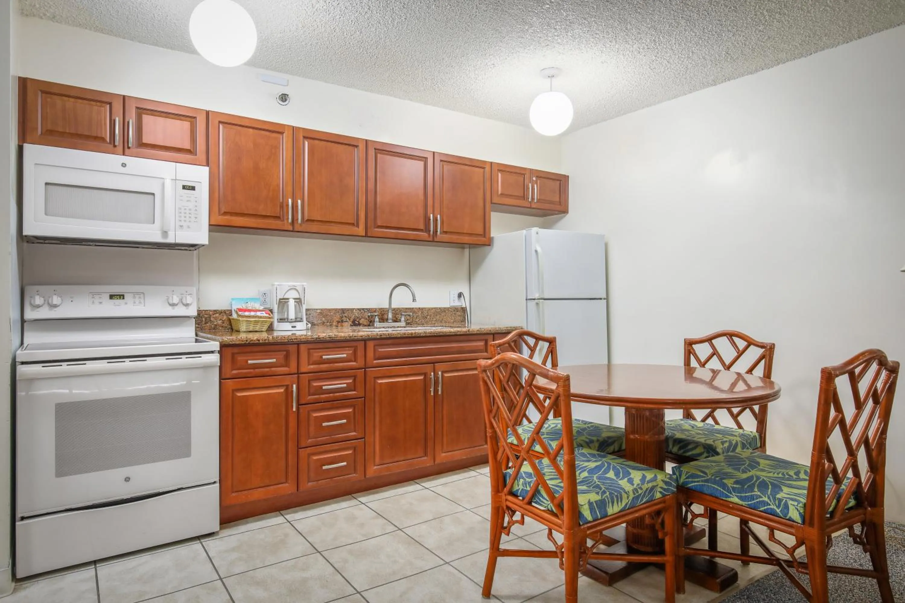 Kitchen or kitchenette in Aston at the Waikiki Banyan