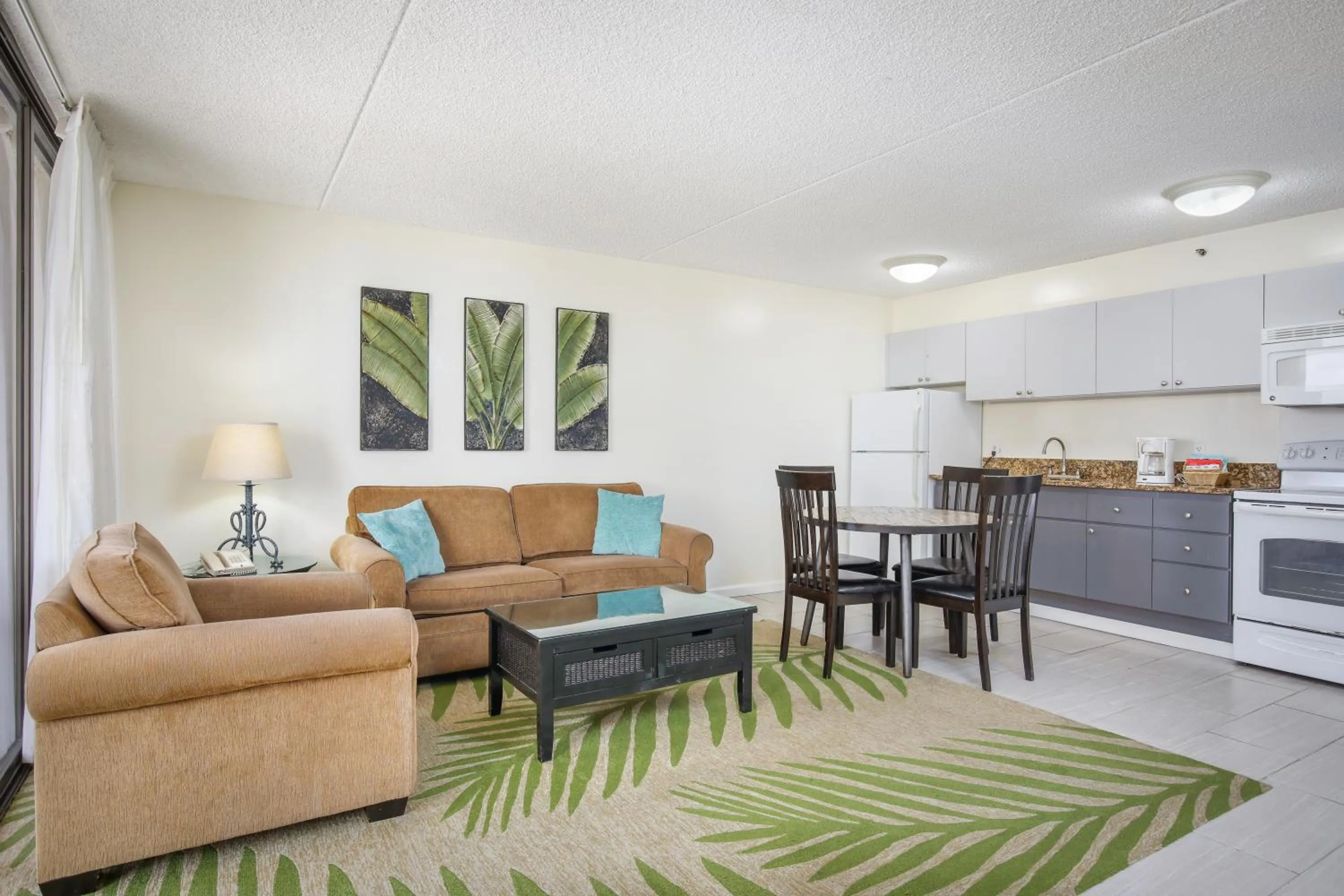 Kitchen or kitchenette in Aston at the Waikiki Banyan