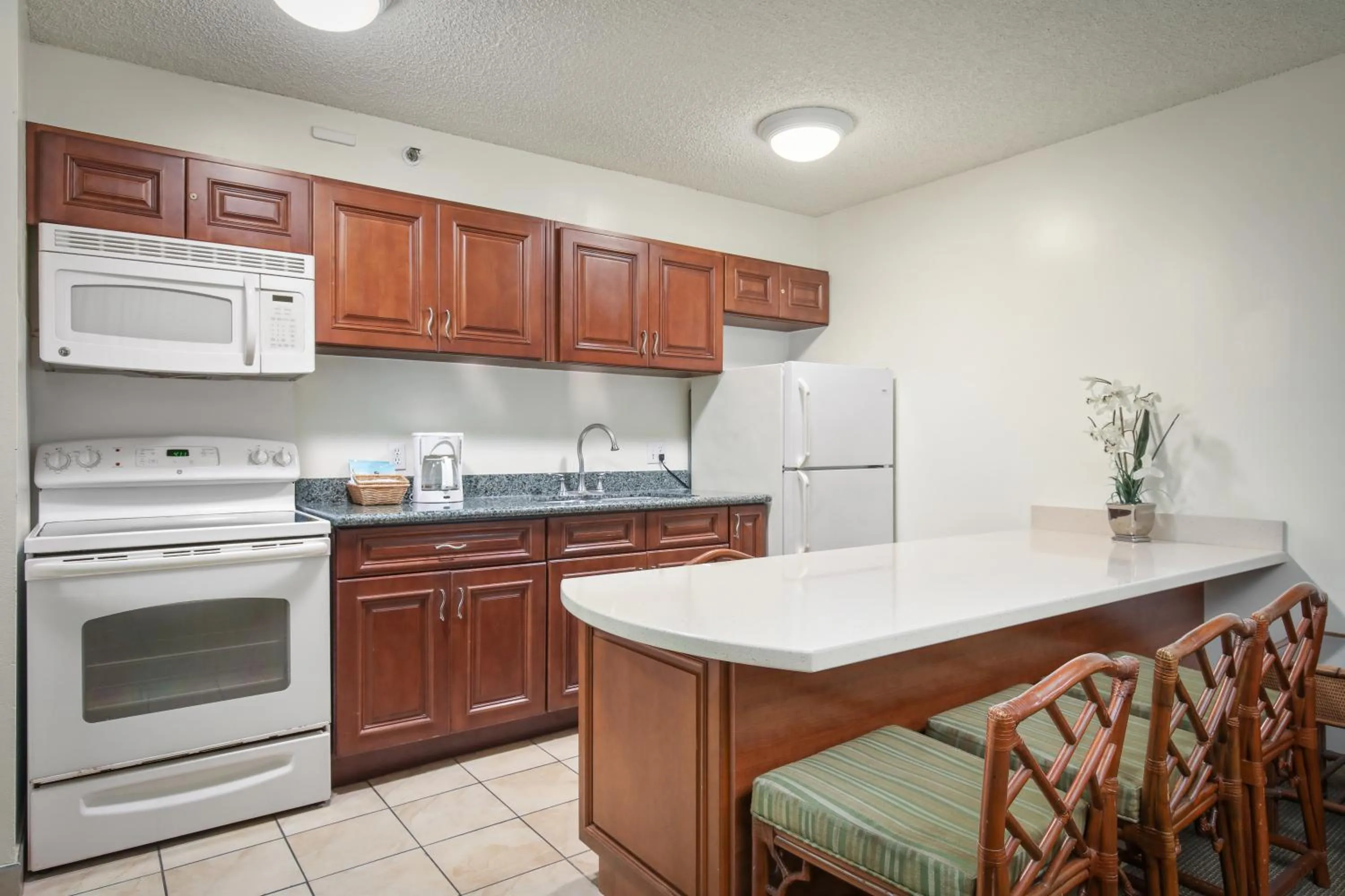 Kitchen or kitchenette in Aston at the Waikiki Banyan