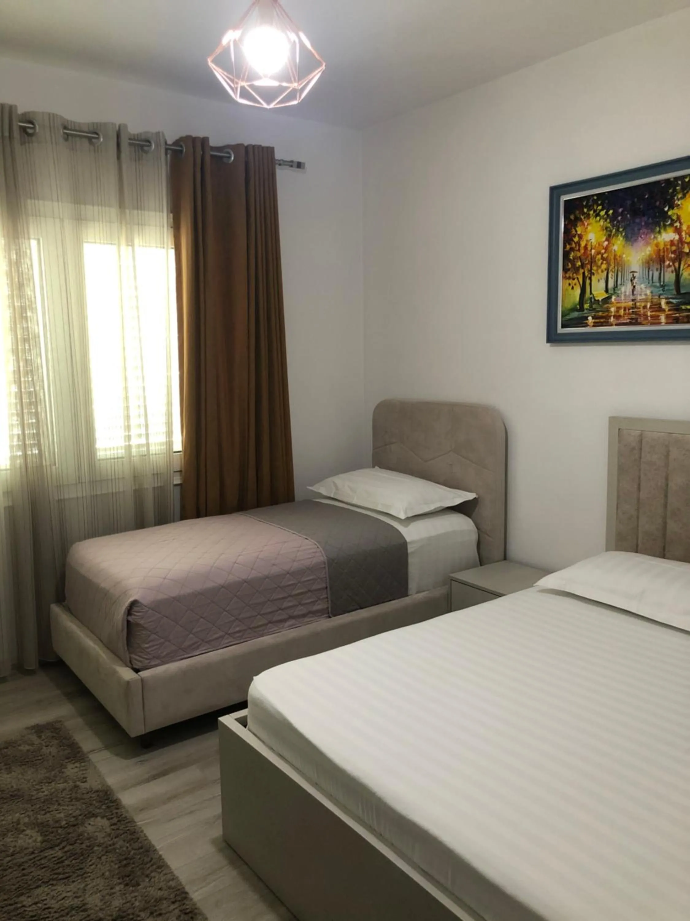 Bed in Brilant Apartament