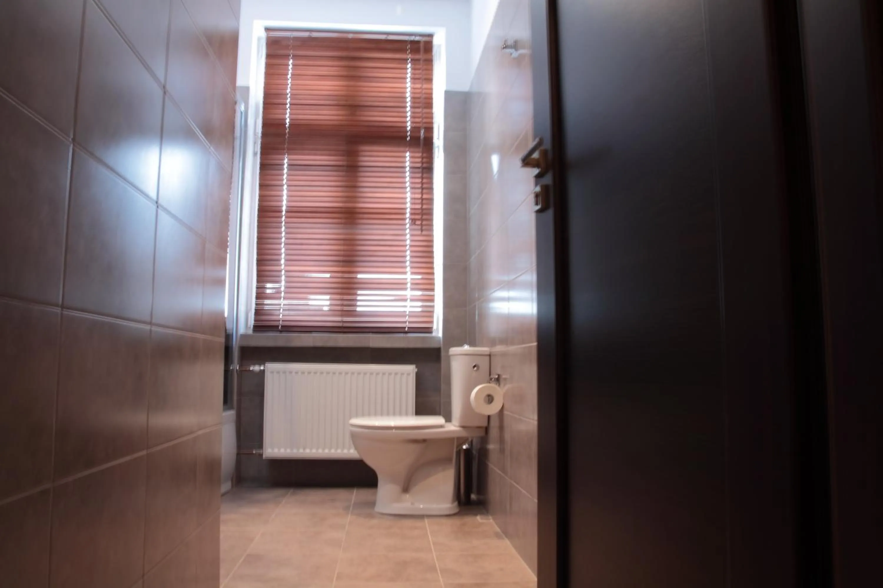 Toilet in Glam House Apartments