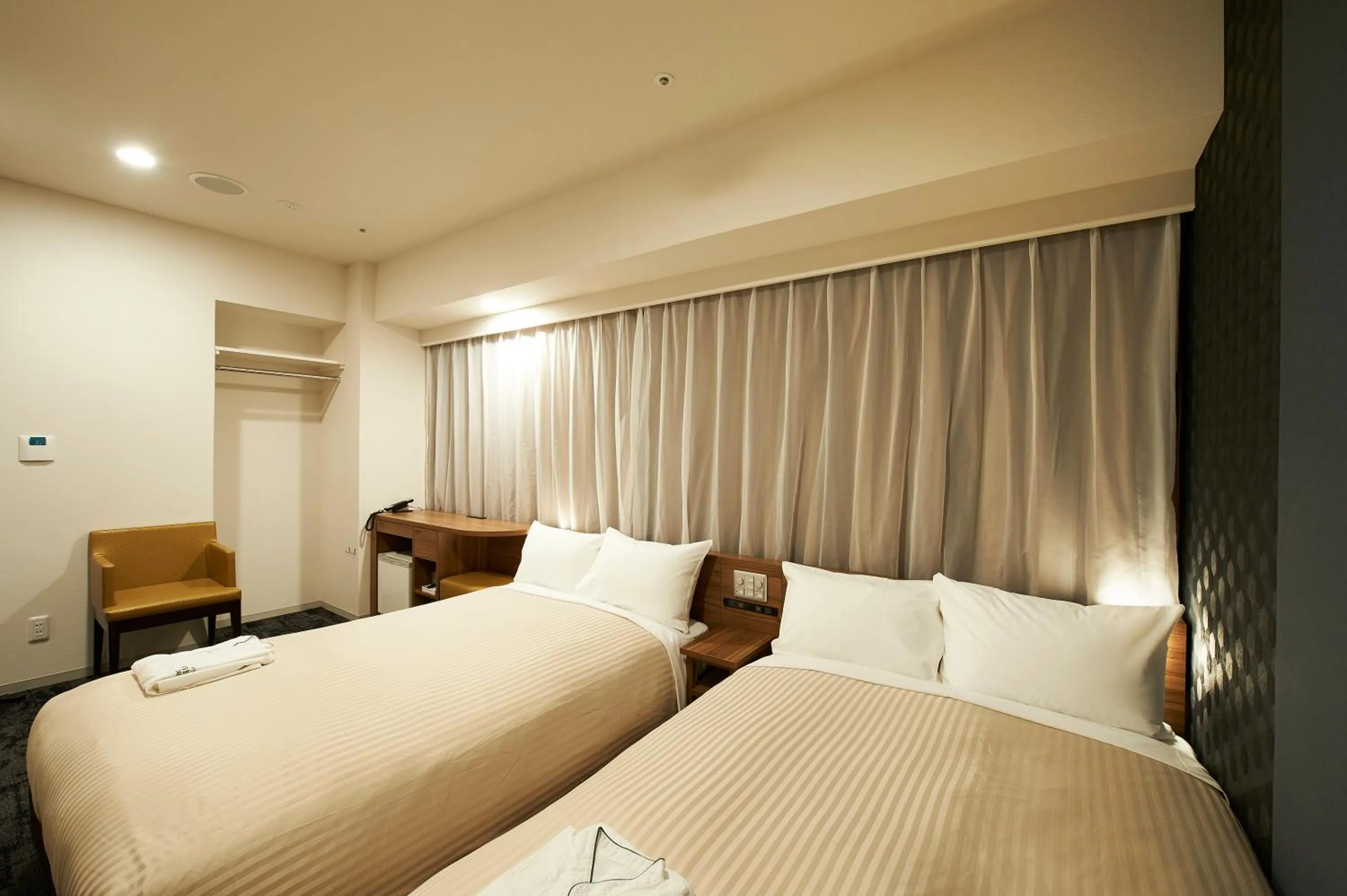 Photo of the whole room, Bed in Sotetsu Fresa Inn Kitahama