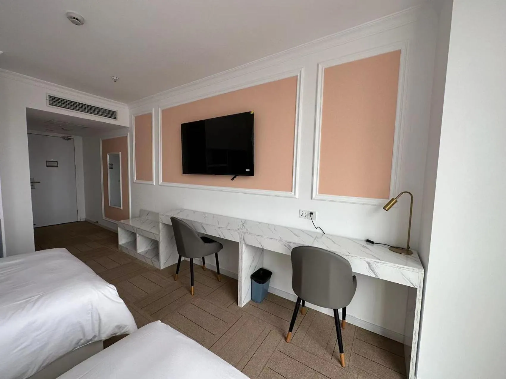 Bed in Magnificent International Hotel