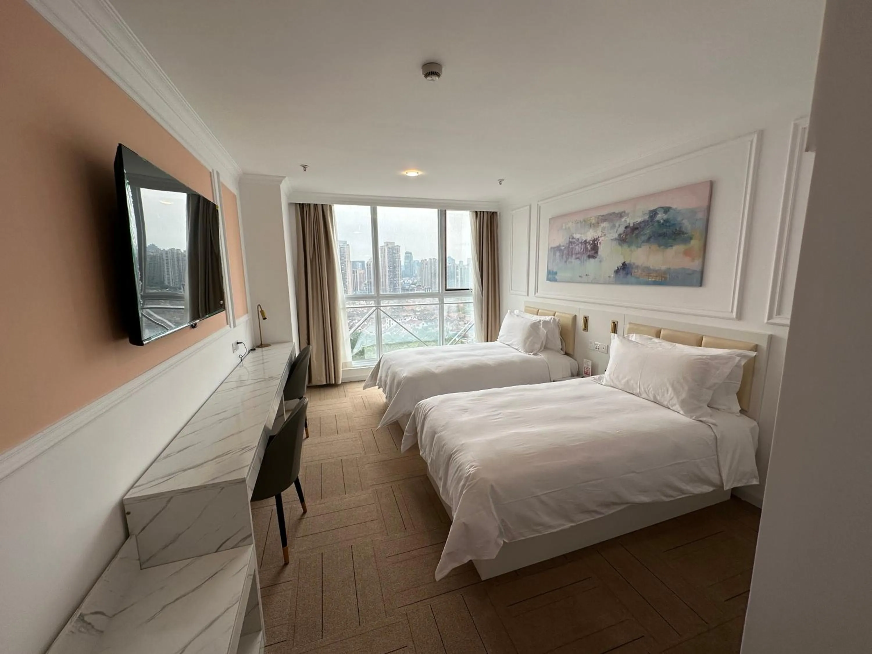 Bed in Magnificent International Hotel