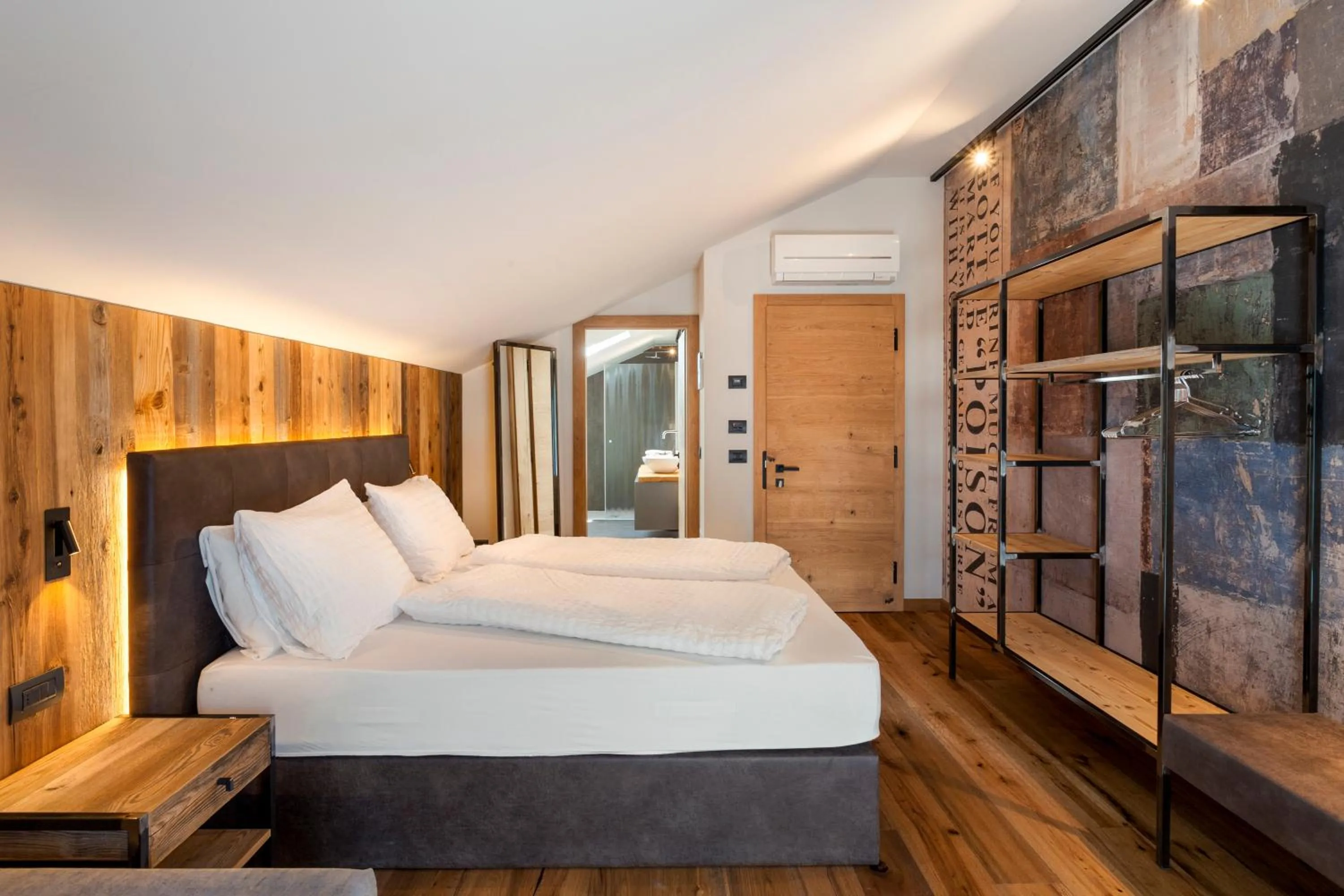 Bed in Alpotel Dolomiten