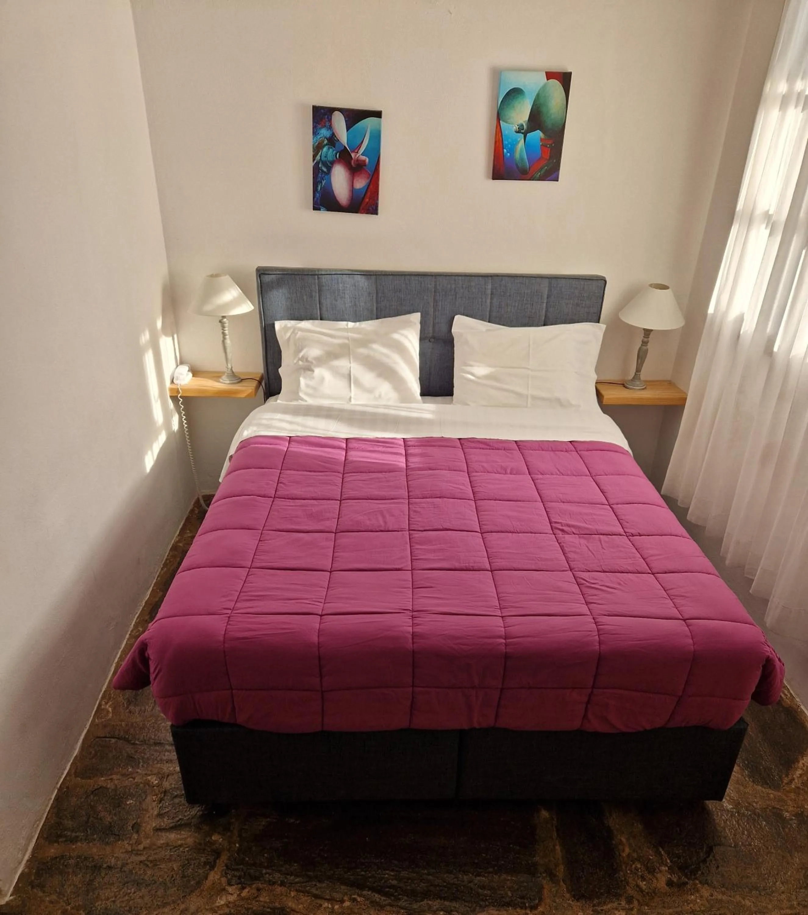 Bed in Scorpios Hotel & Suites
