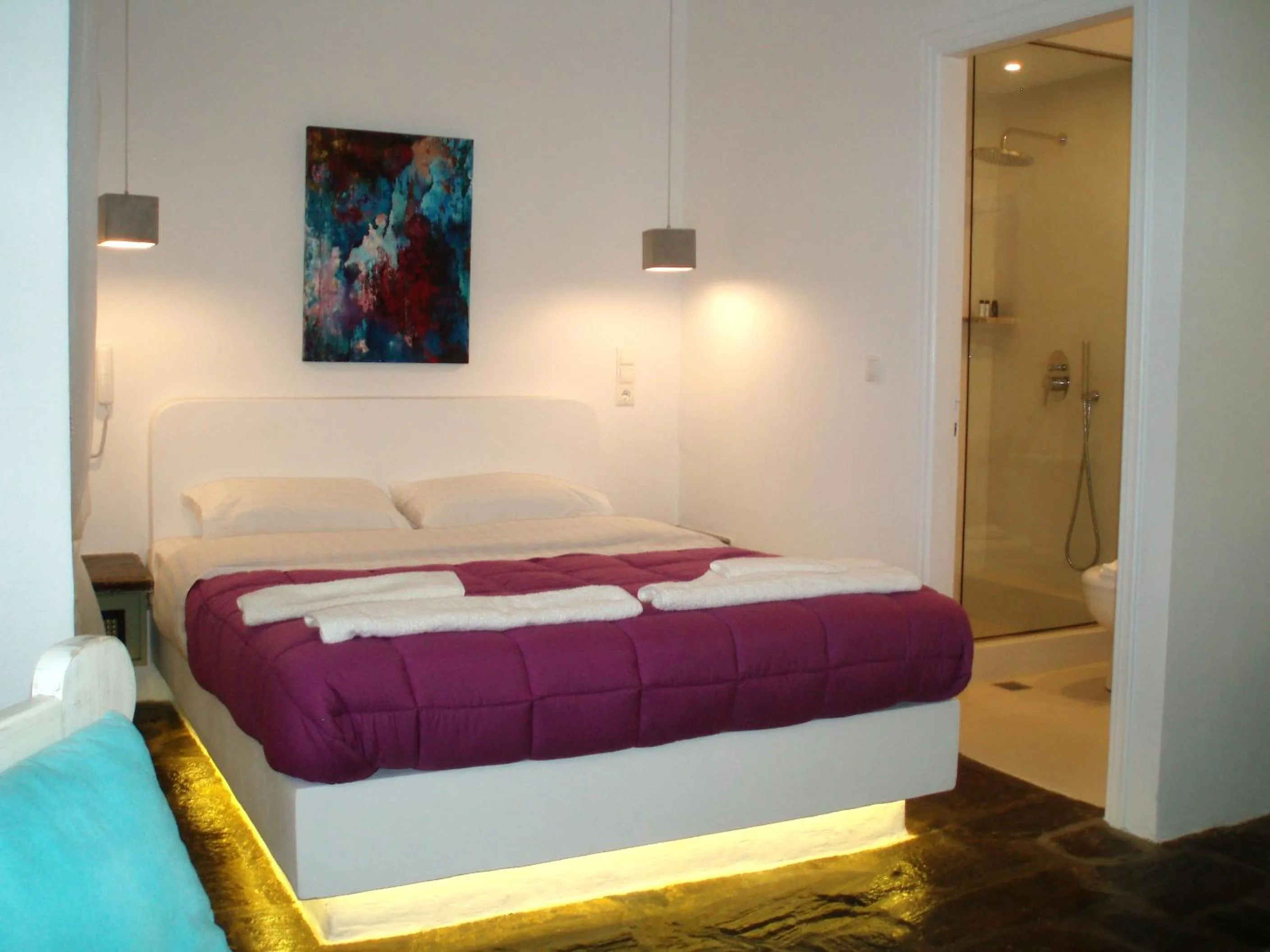 Bed in Scorpios Hotel & Suites