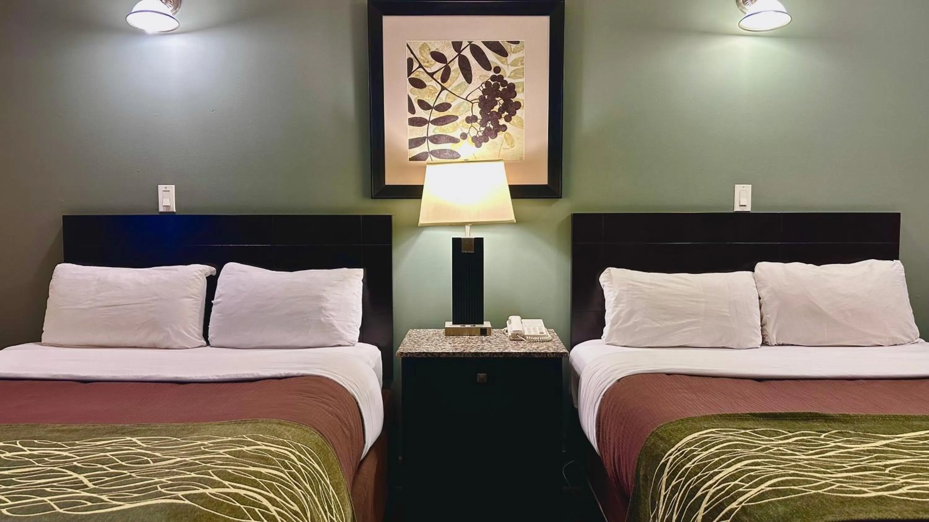 Bed in Lacombe Motor Inn