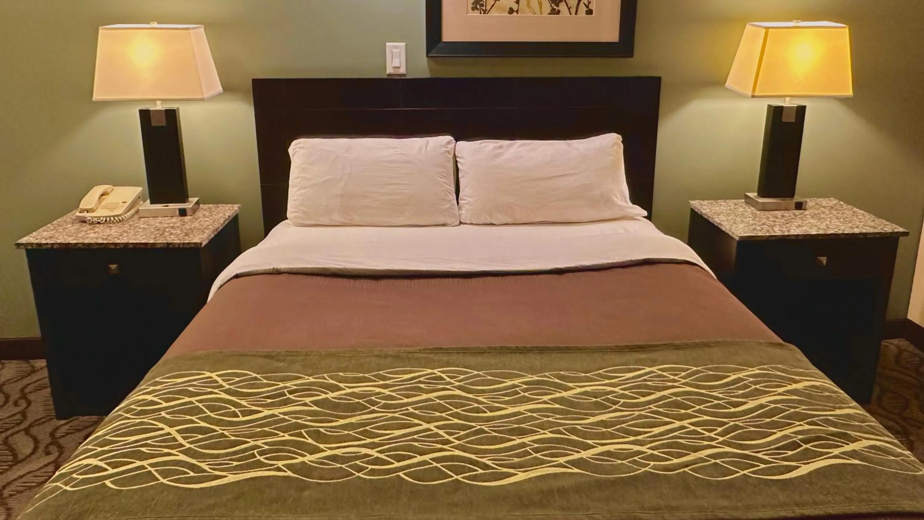 Bed in Lacombe Motor Inn