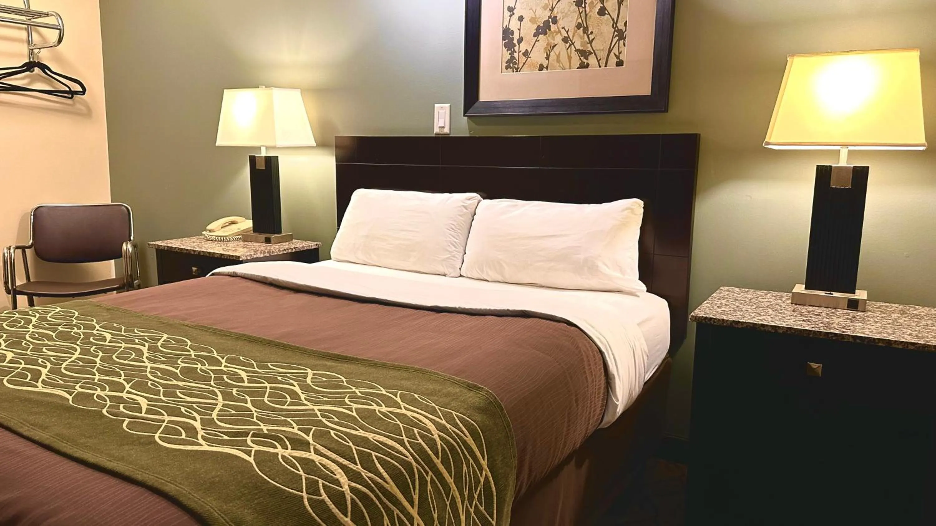 Bed in Lacombe Motor Inn