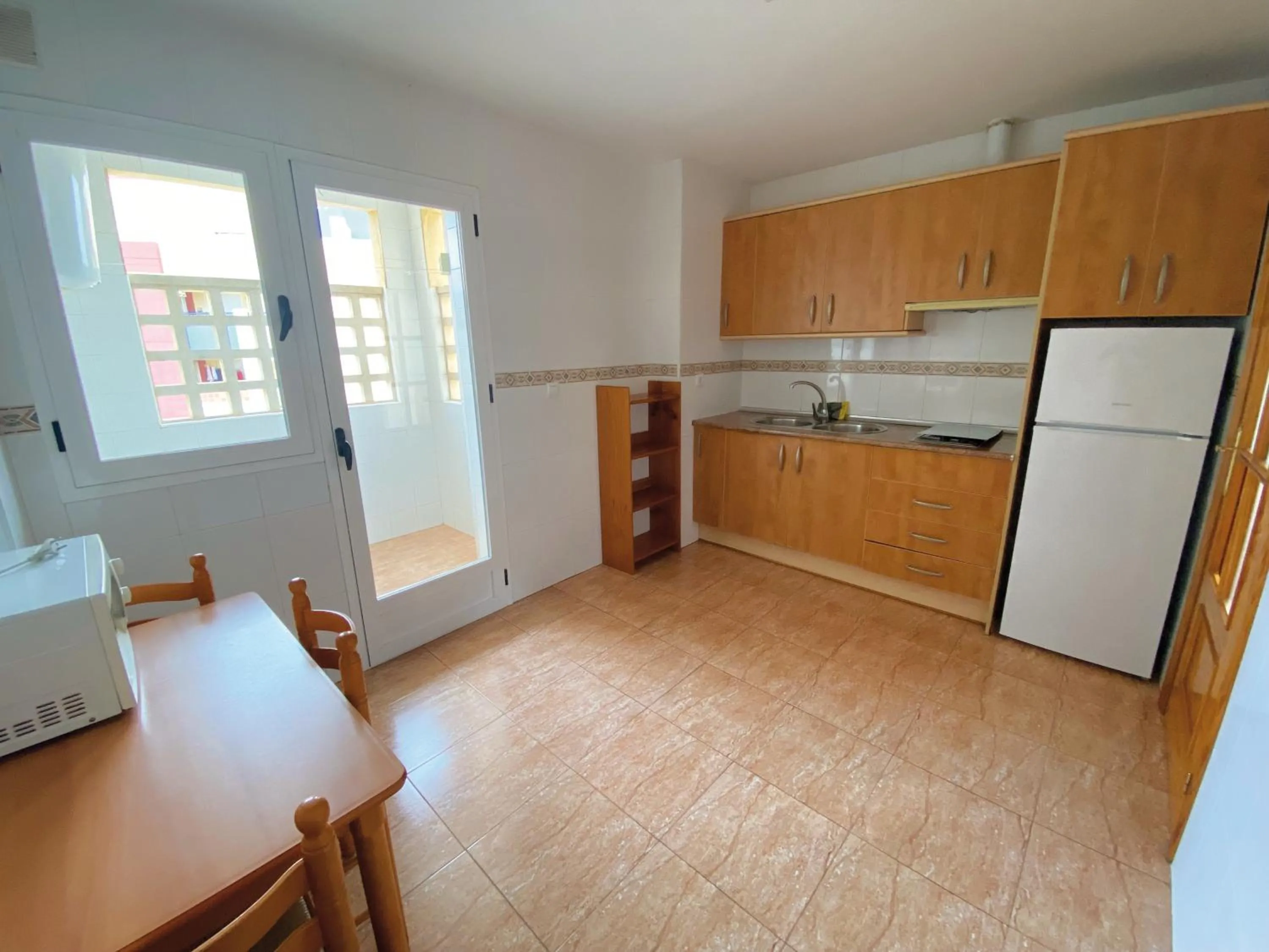 Kitchen or kitchenette in Apartamentos Maracay