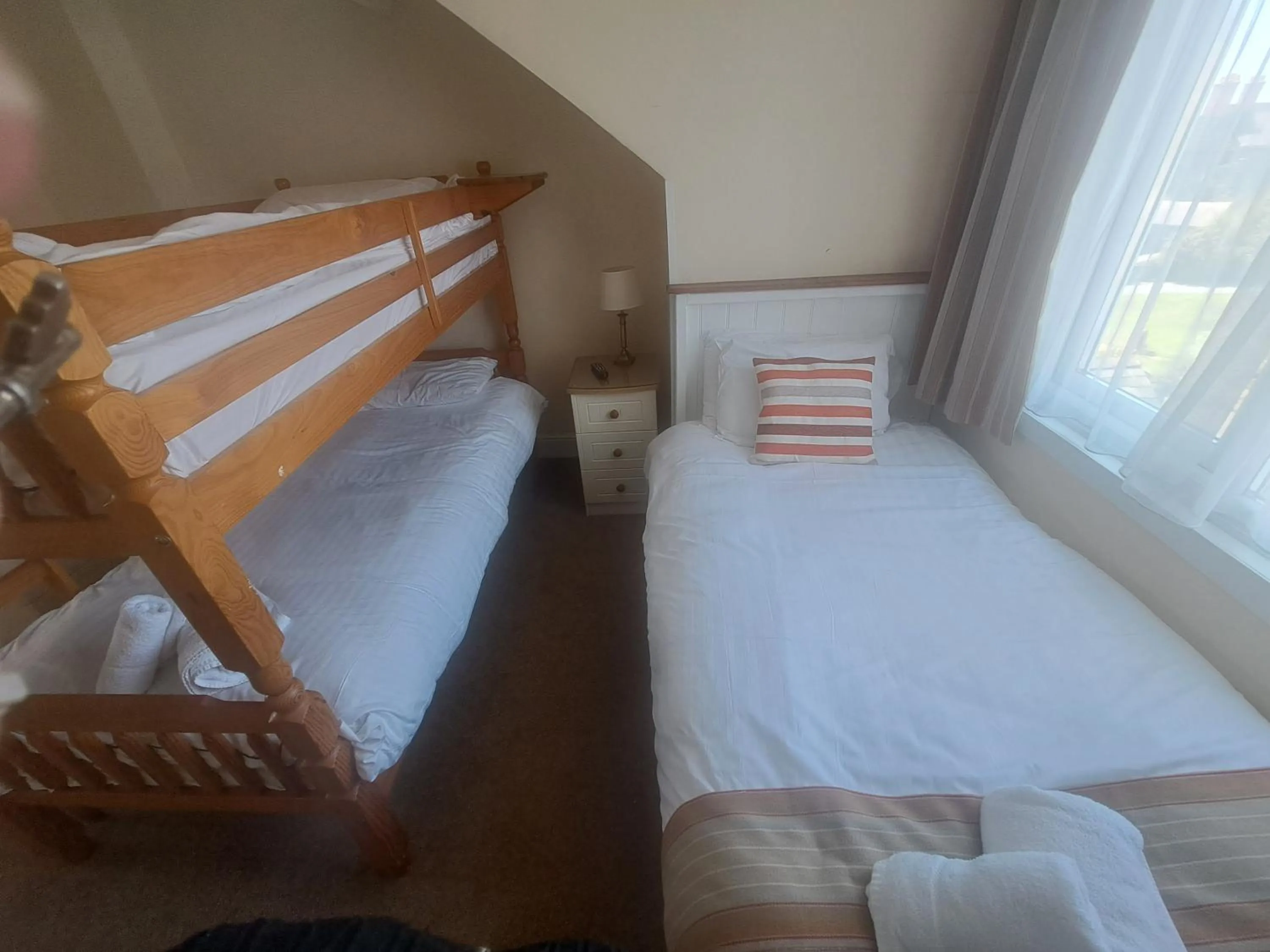 Bed in Lion Hotel & Studio Apartments