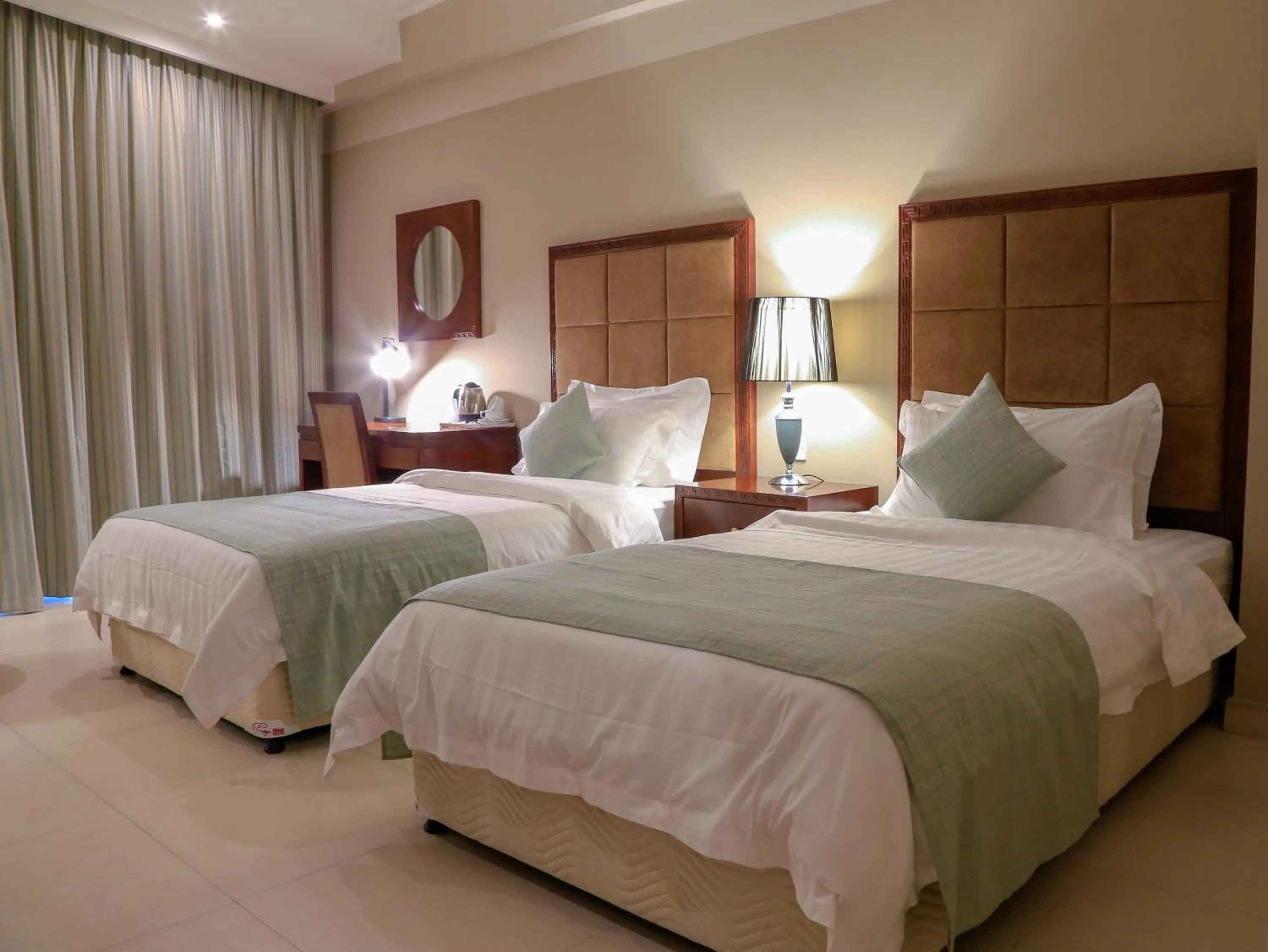 Photo of the whole room, Bed in Muscat Inn Hotel