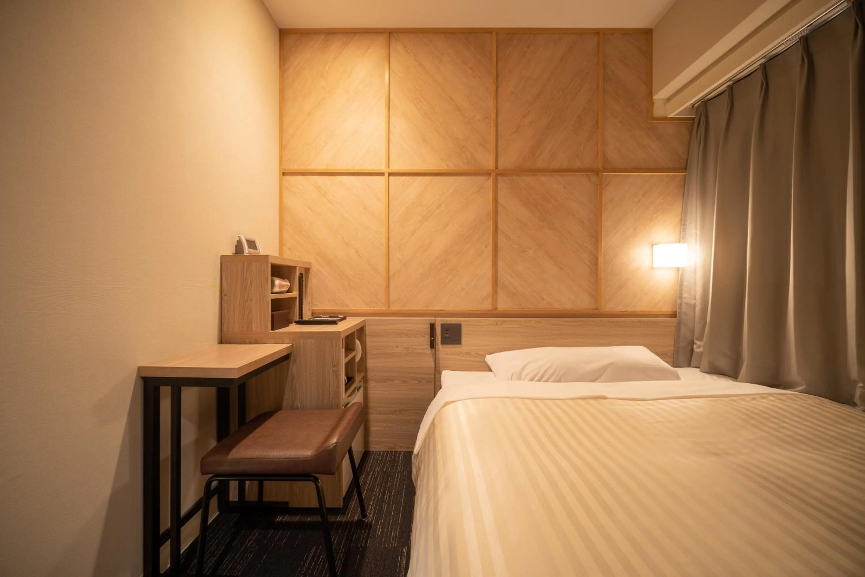 Bed in Super Hotel Kobe