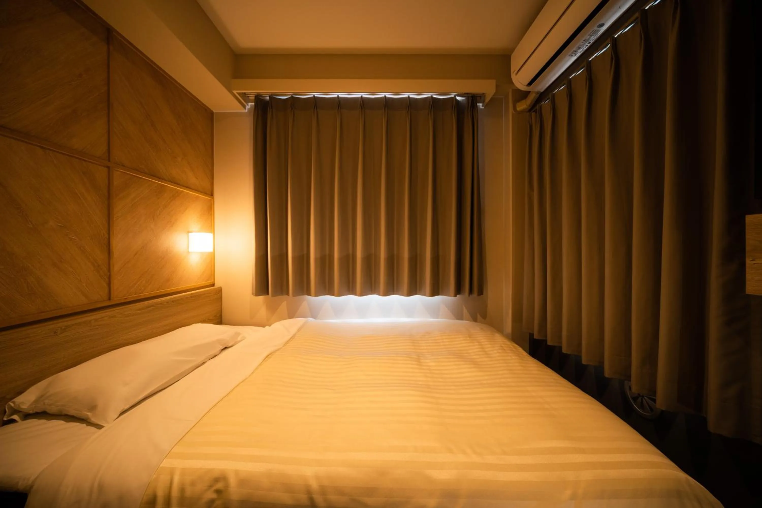 Bed in Super Hotel Kobe