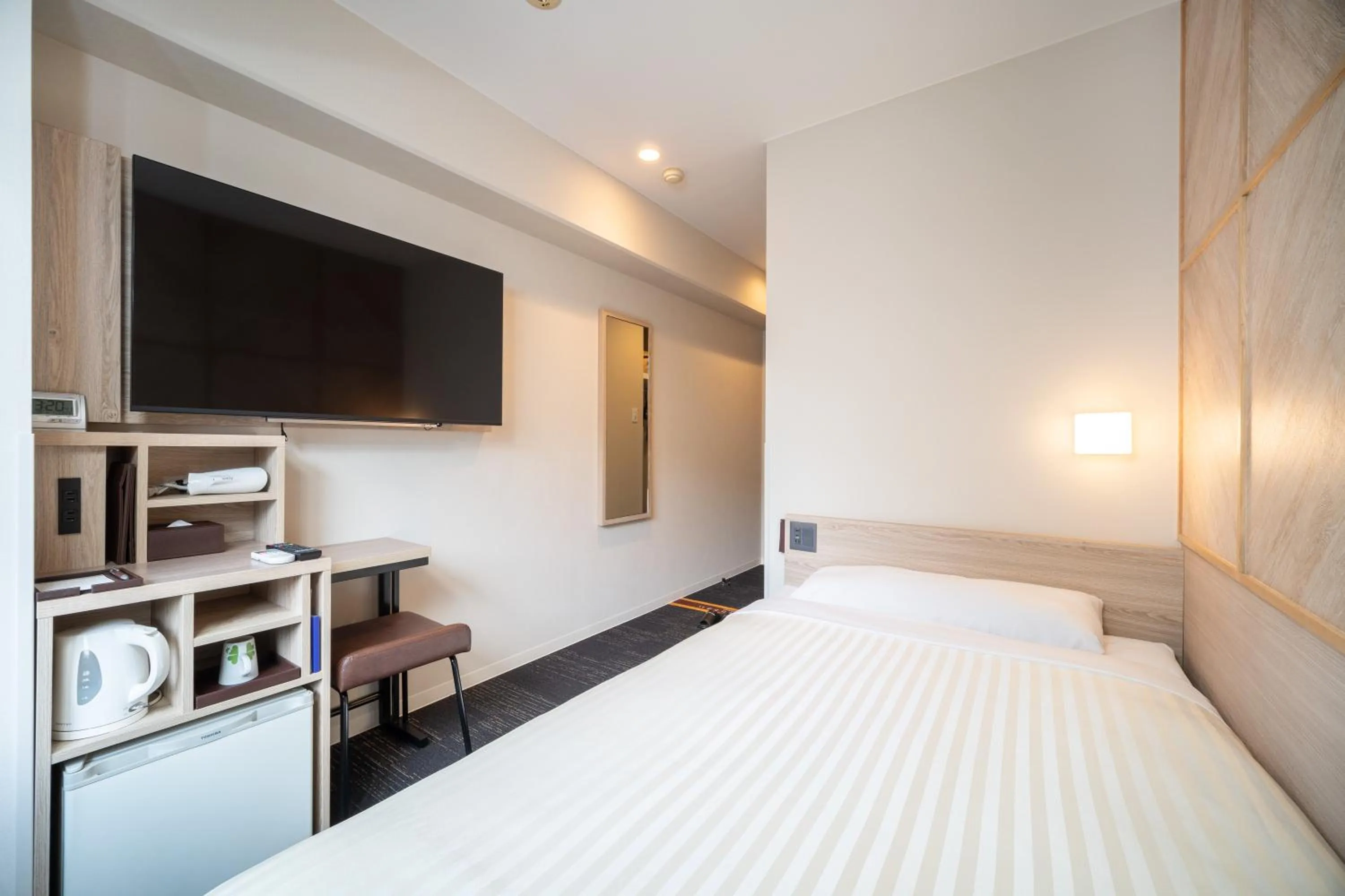 Bed in Super Hotel Kobe