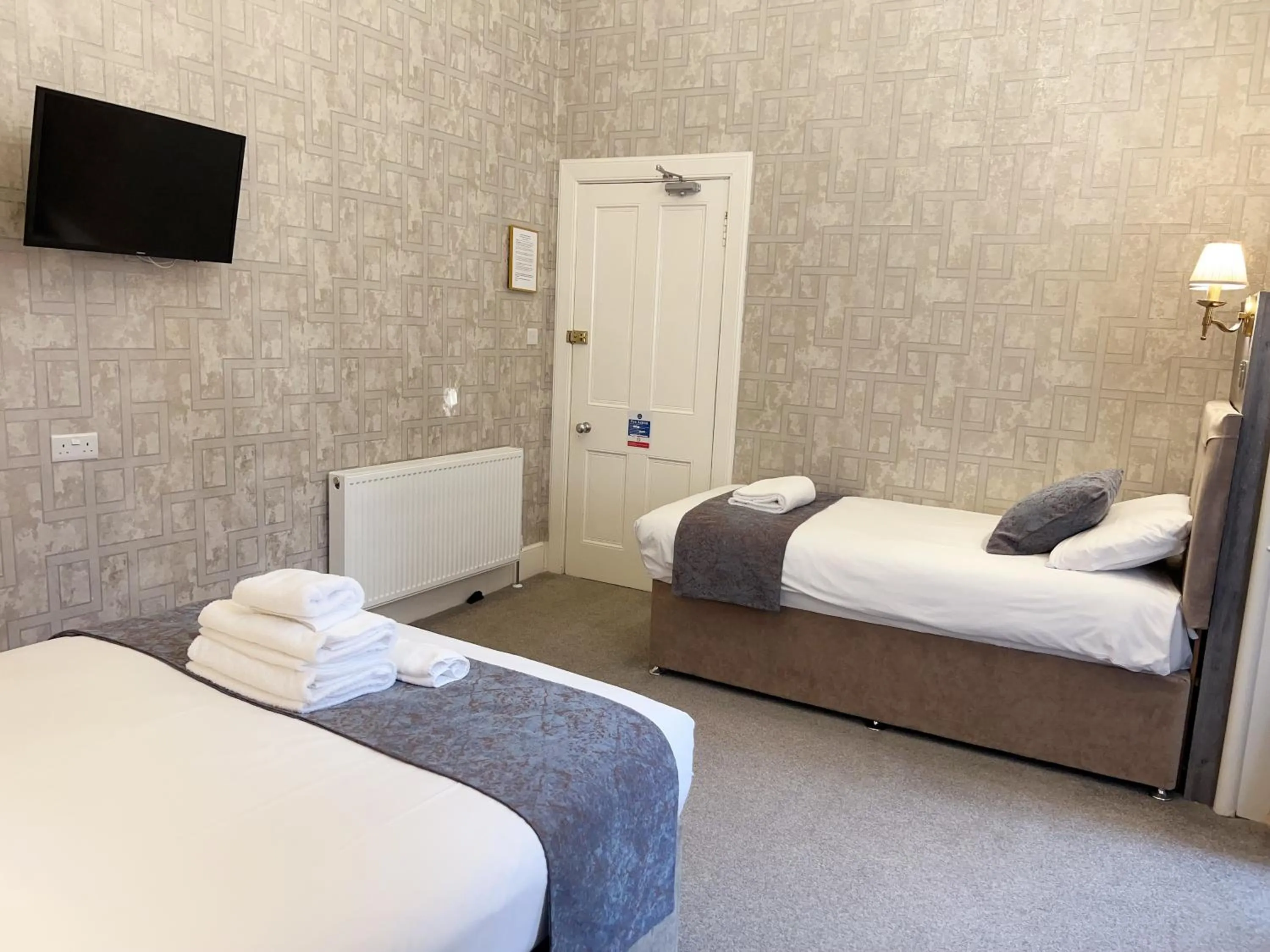 Bed in Alexander Guest House