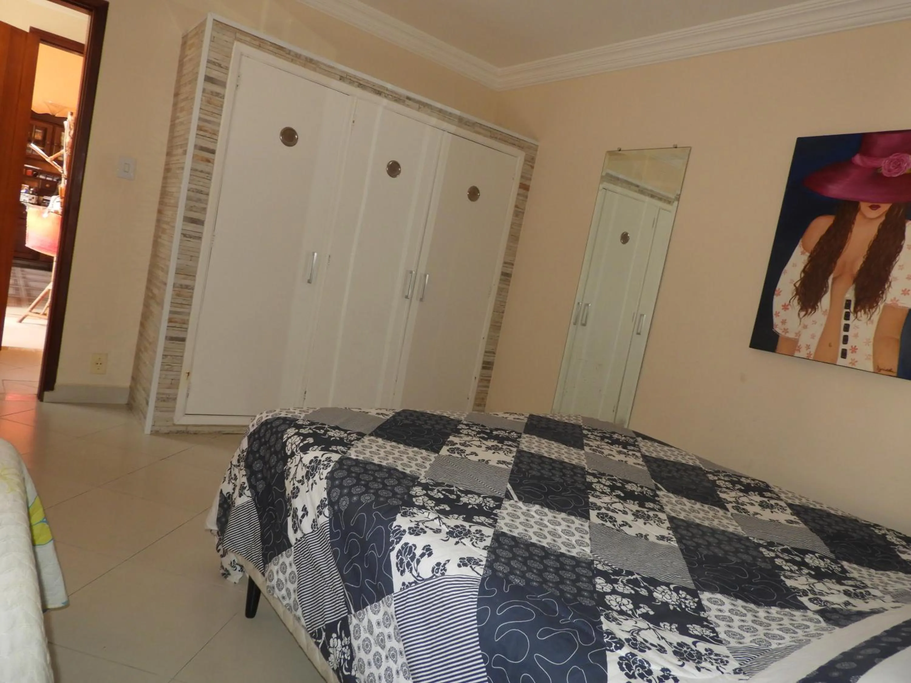 Bed in ACIOLY'S BEACH HOUSE