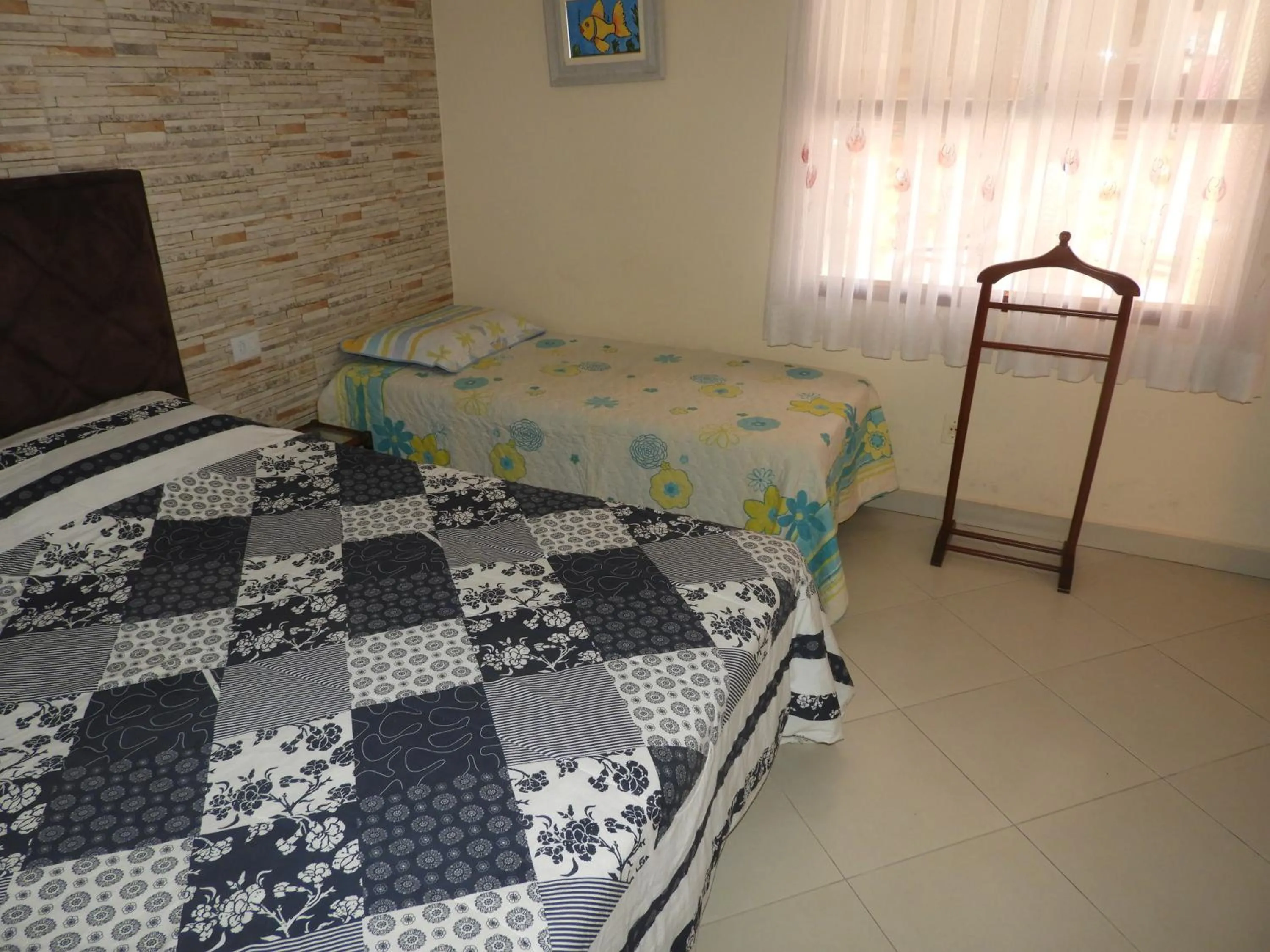Bed in ACIOLY'S BEACH HOUSE