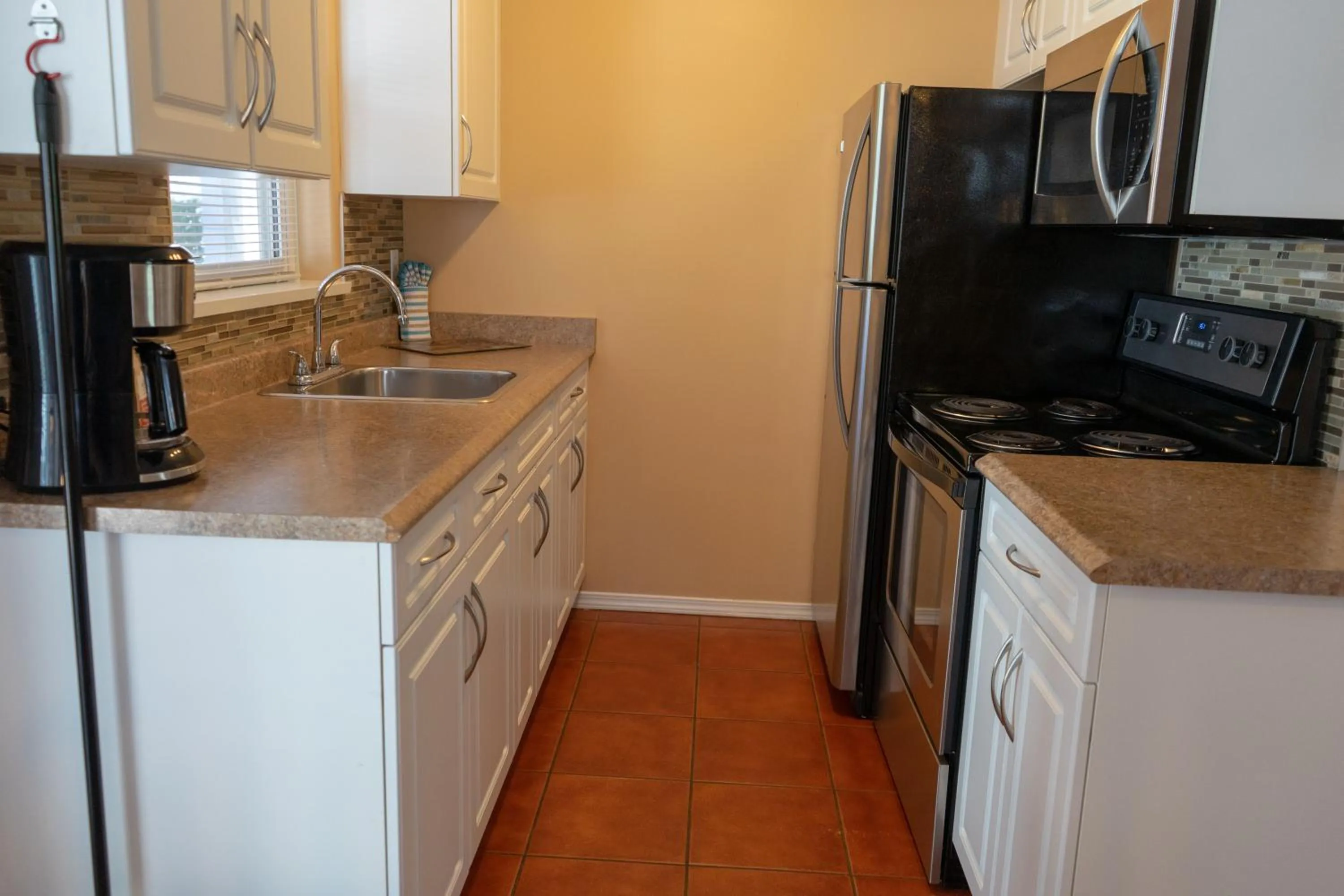 Kitchen or kitchenette in Sandy Beach Suites