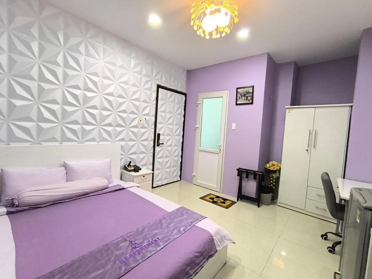 Bed in HT Hotel Apartment