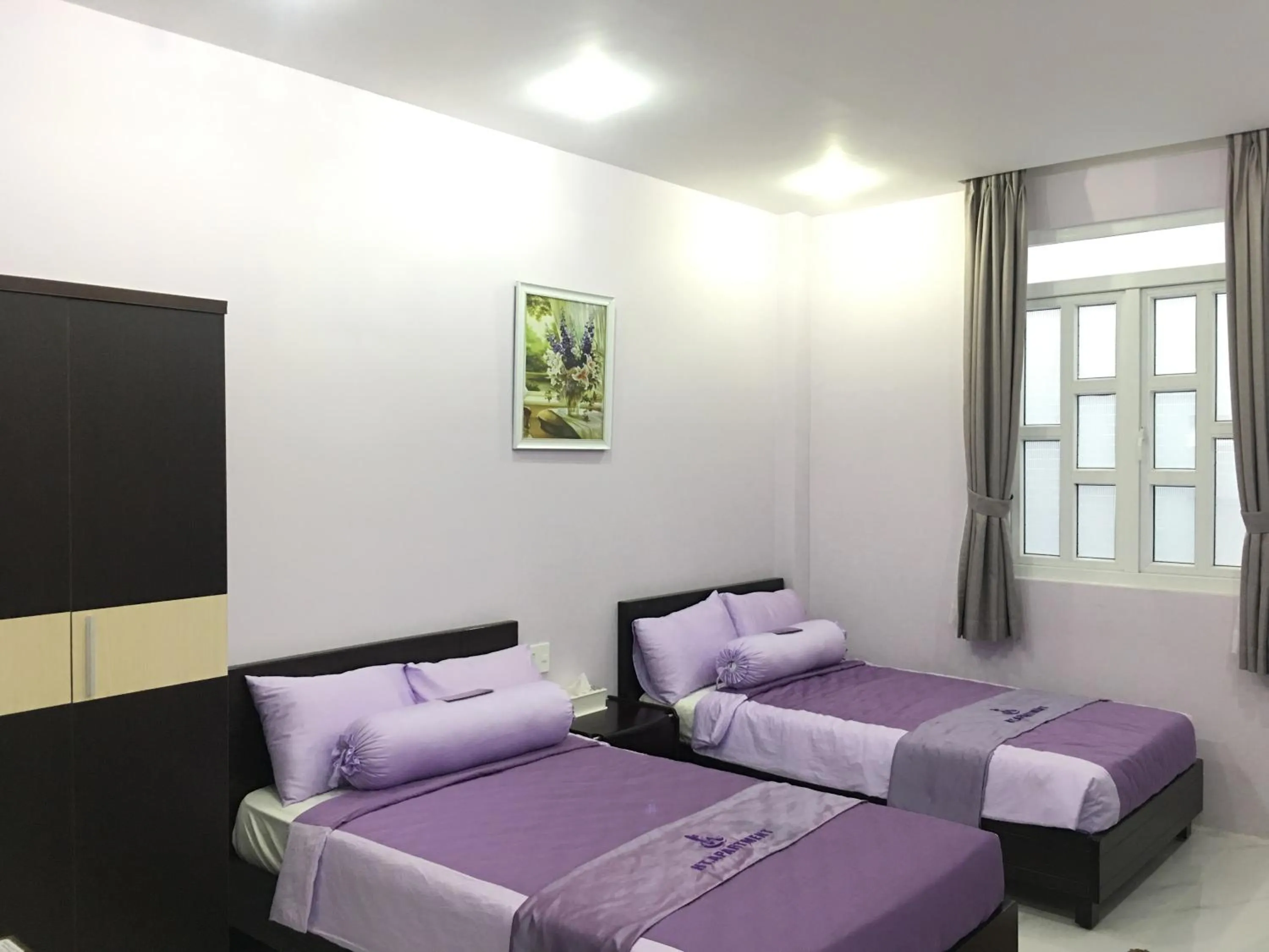 Bed in HT Hotel Apartment