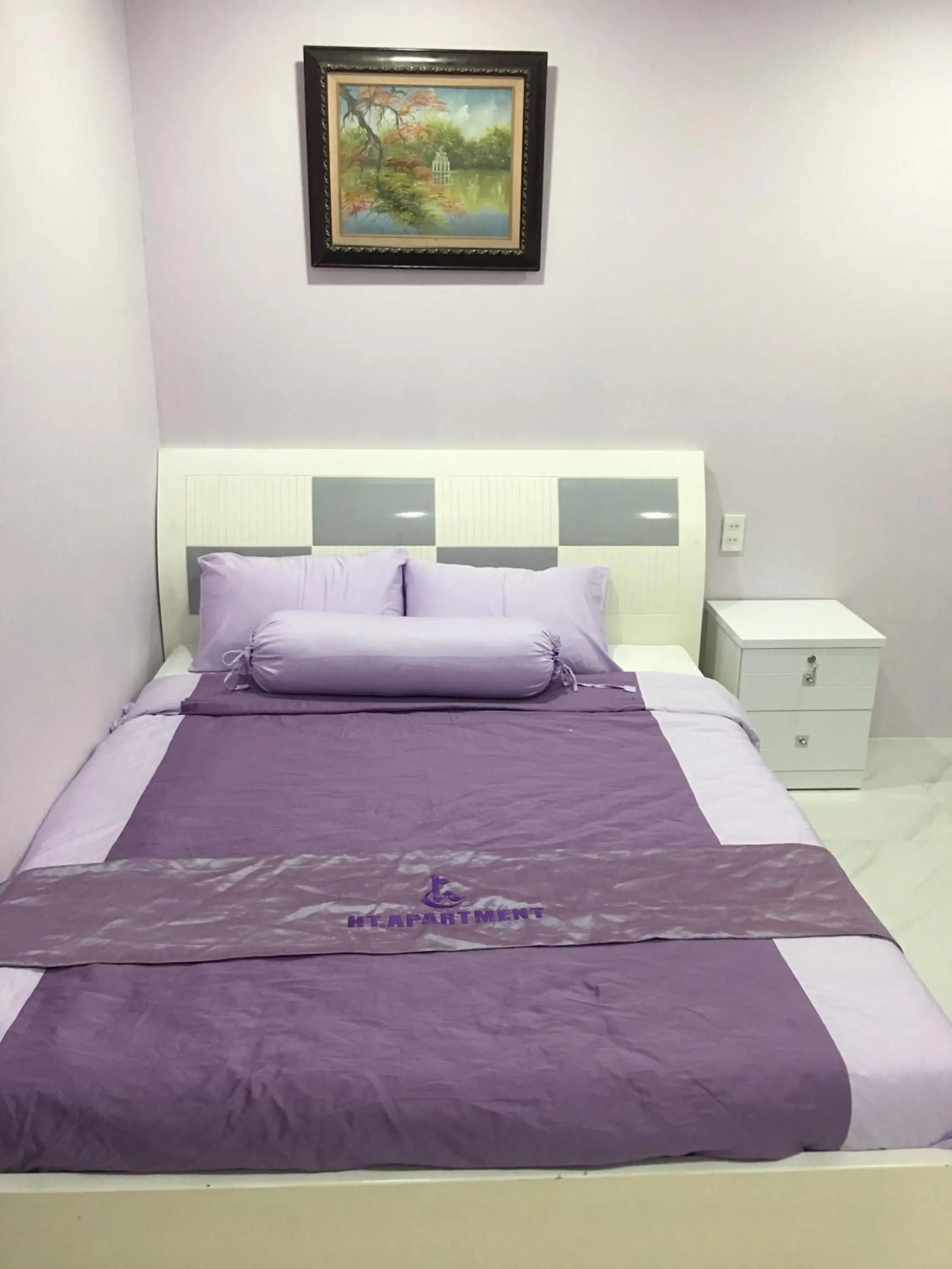 Bed in HT Hotel Apartment