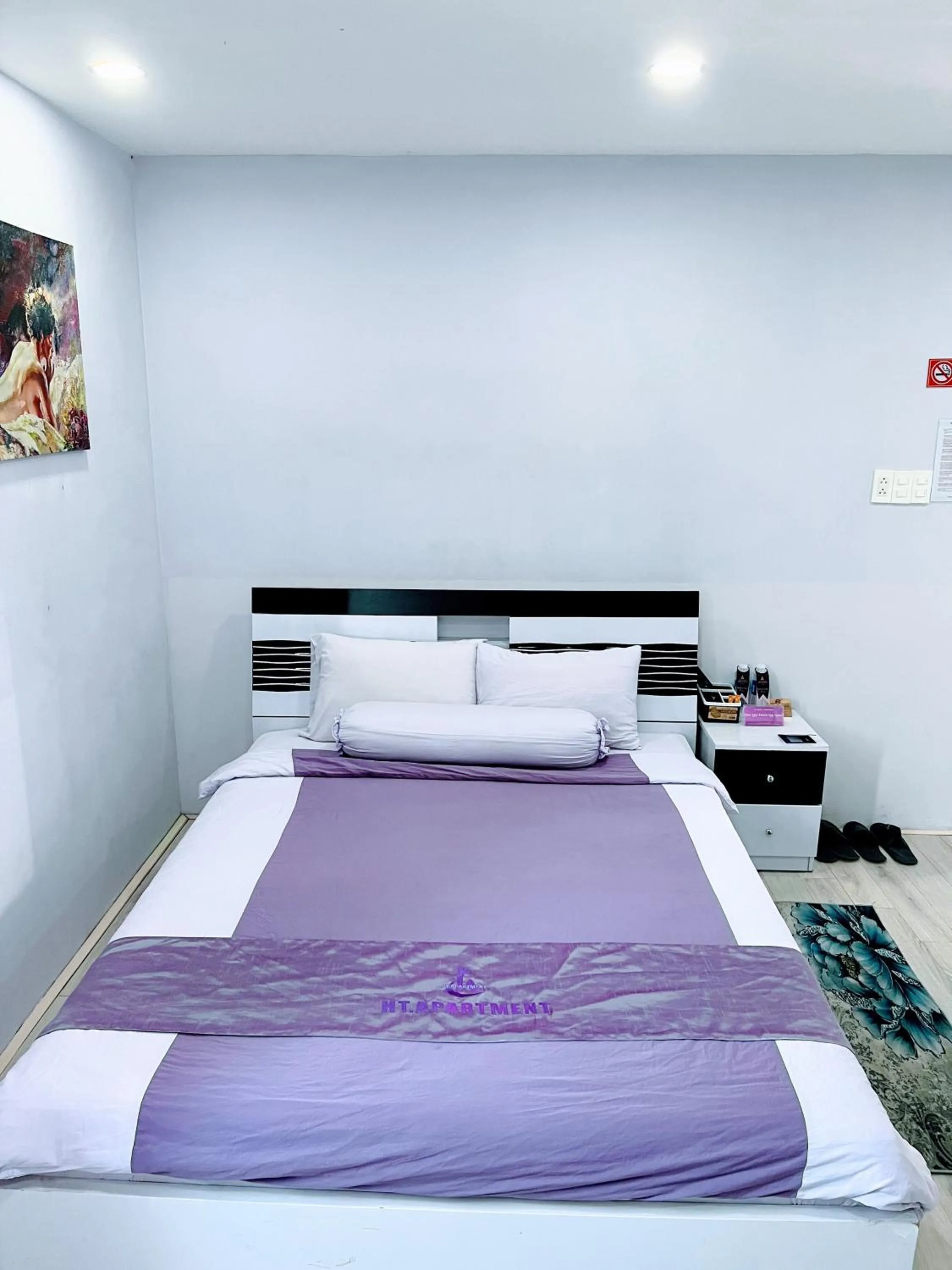 Bed in HT Hotel Apartment