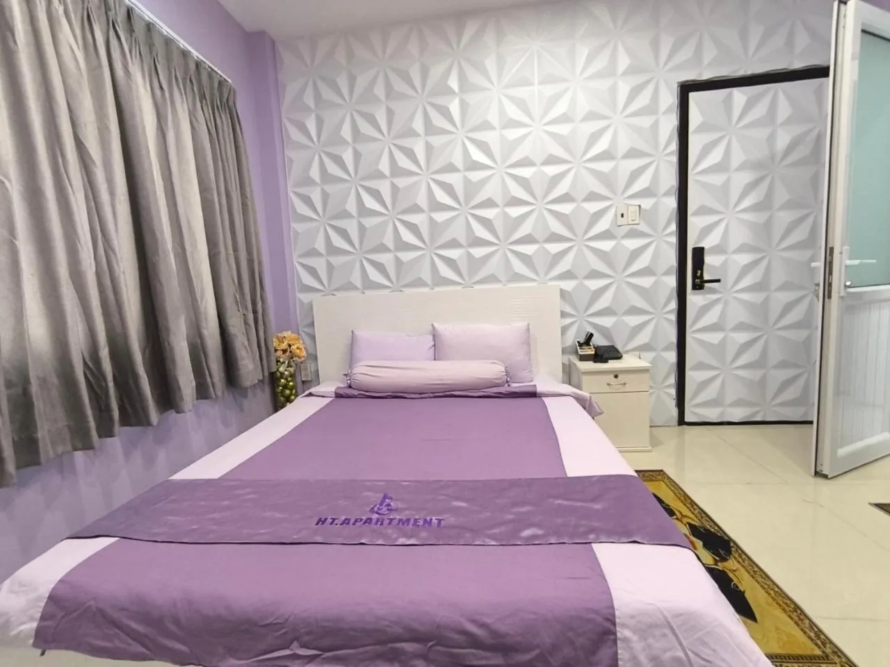 Bed in HT Hotel Apartment