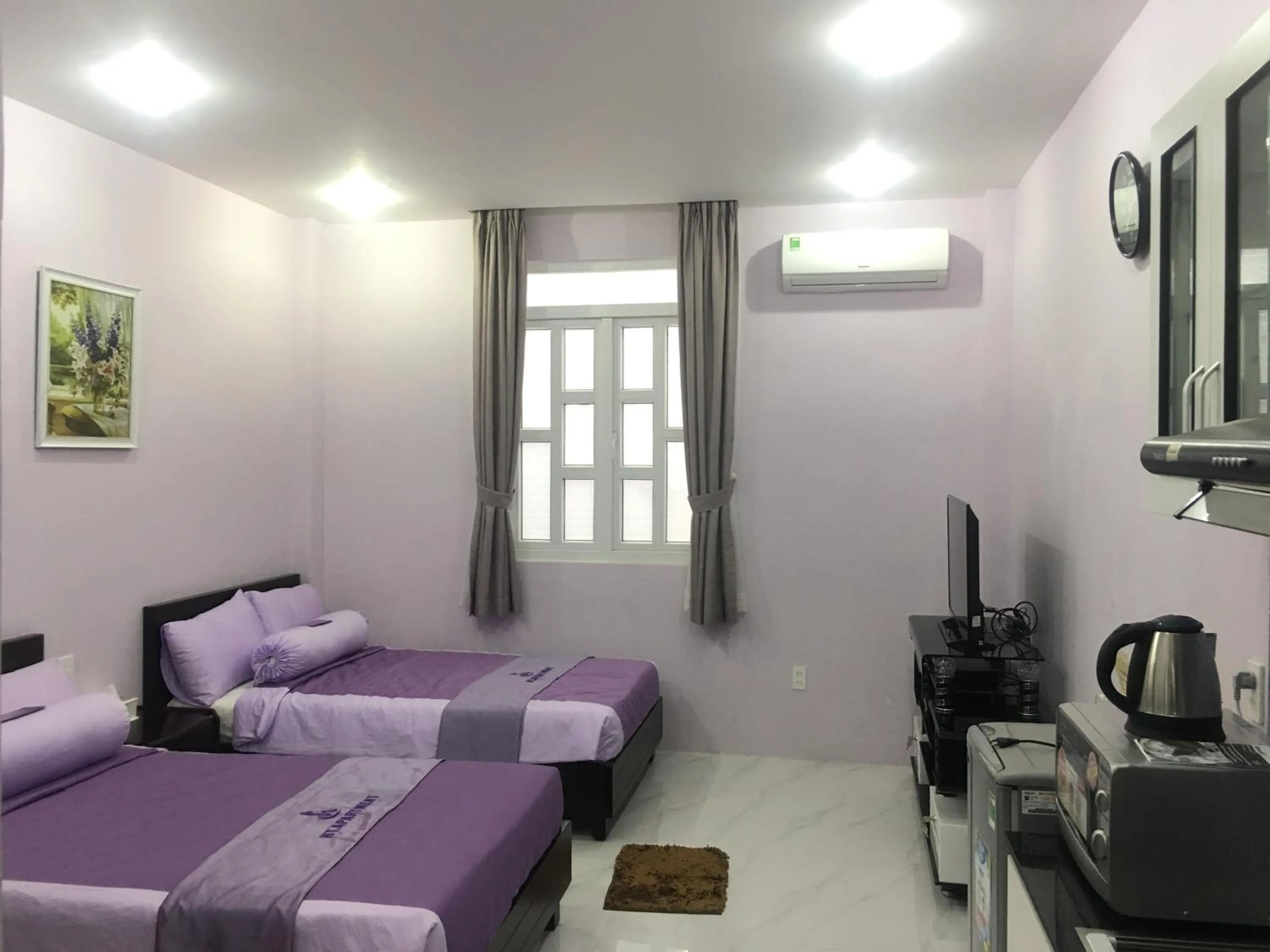 Bed in HT Hotel Apartment