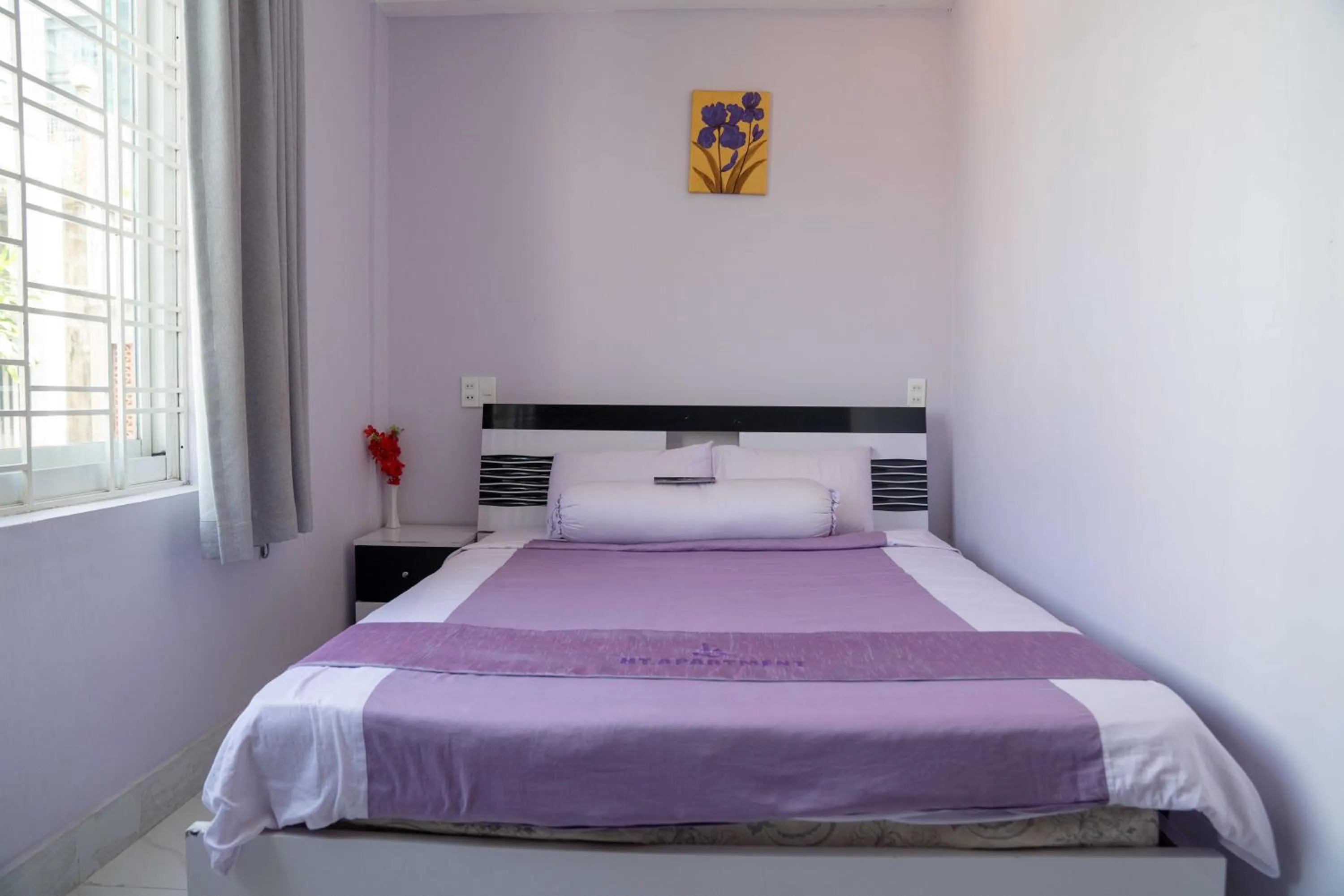 Bed in HT Hotel Apartment