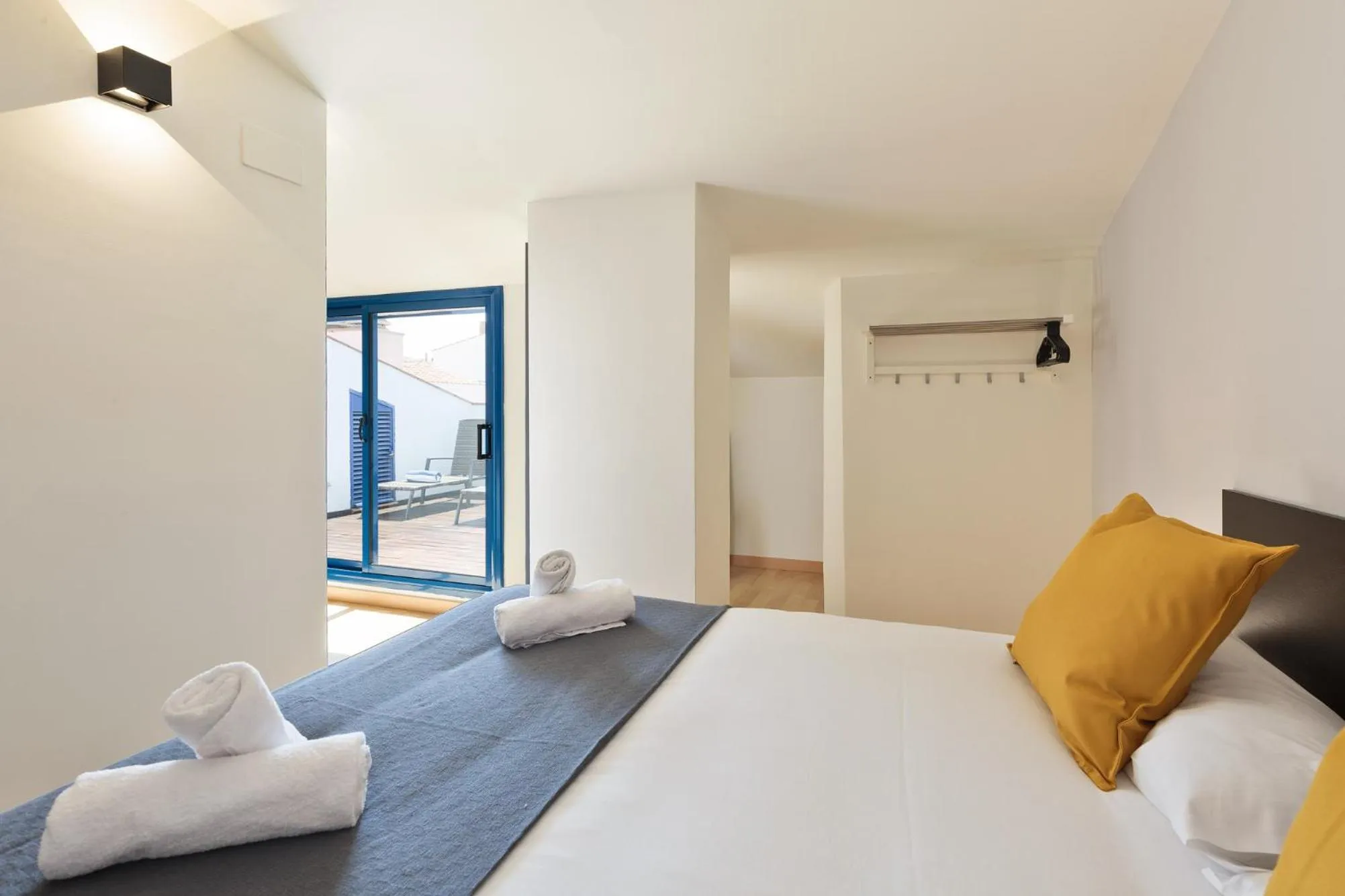 Bed in Lucas House Apartments by Sitges Group