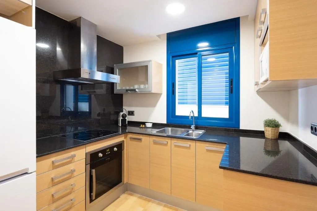 kitchen in Lucas House Apartments by Sitges Group