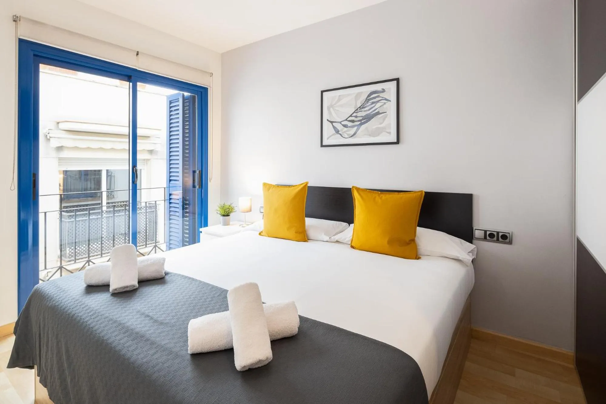 Bed in Lucas House Apartments by Sitges Group