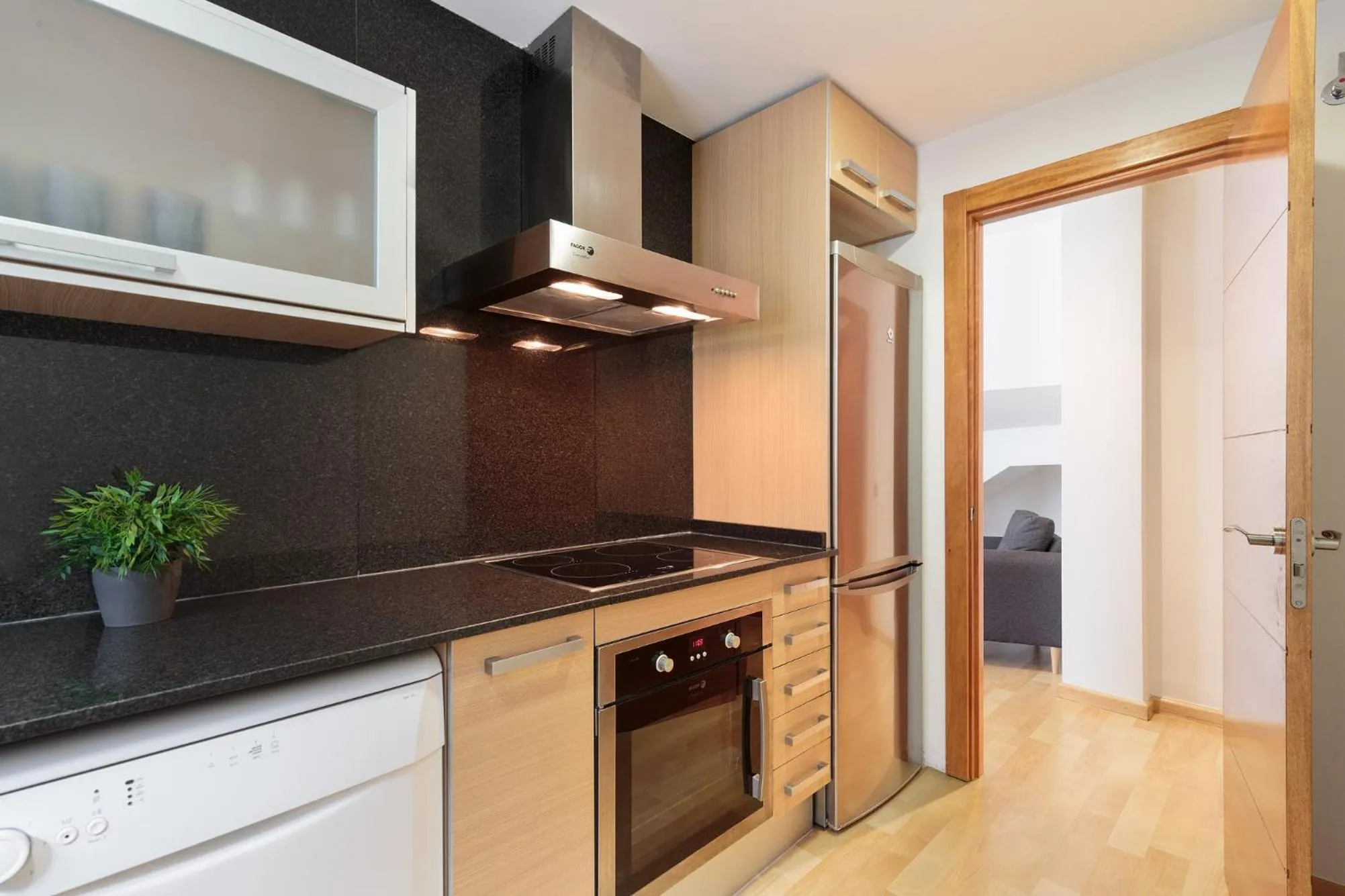 Kitchen or kitchenette in Lucas House Apartments by Sitges Group