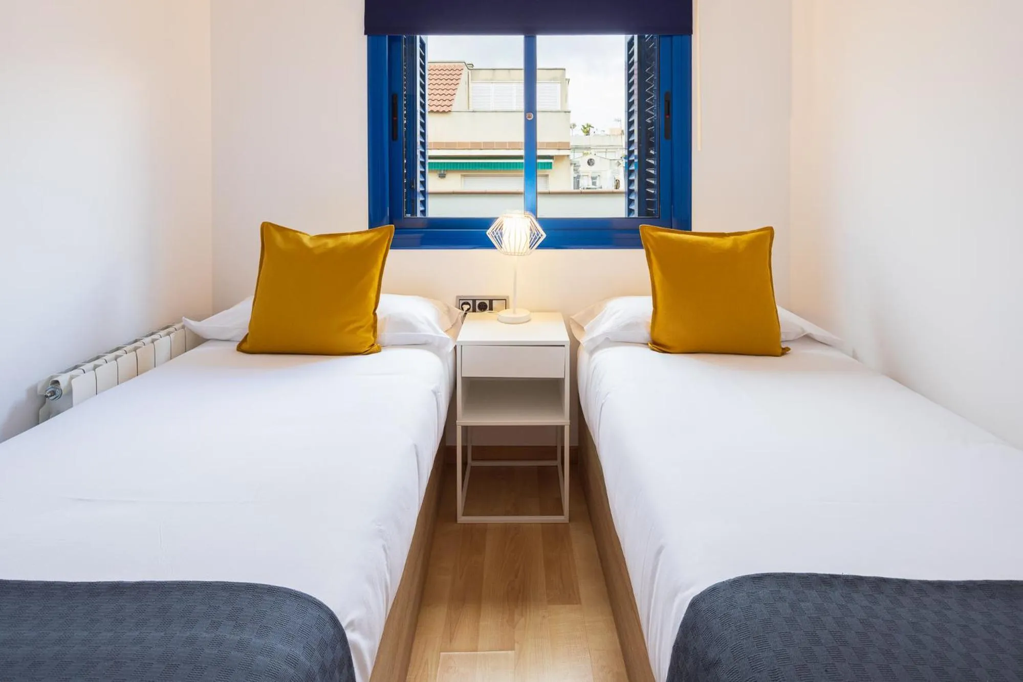 Bed in Lucas House Apartments by Sitges Group