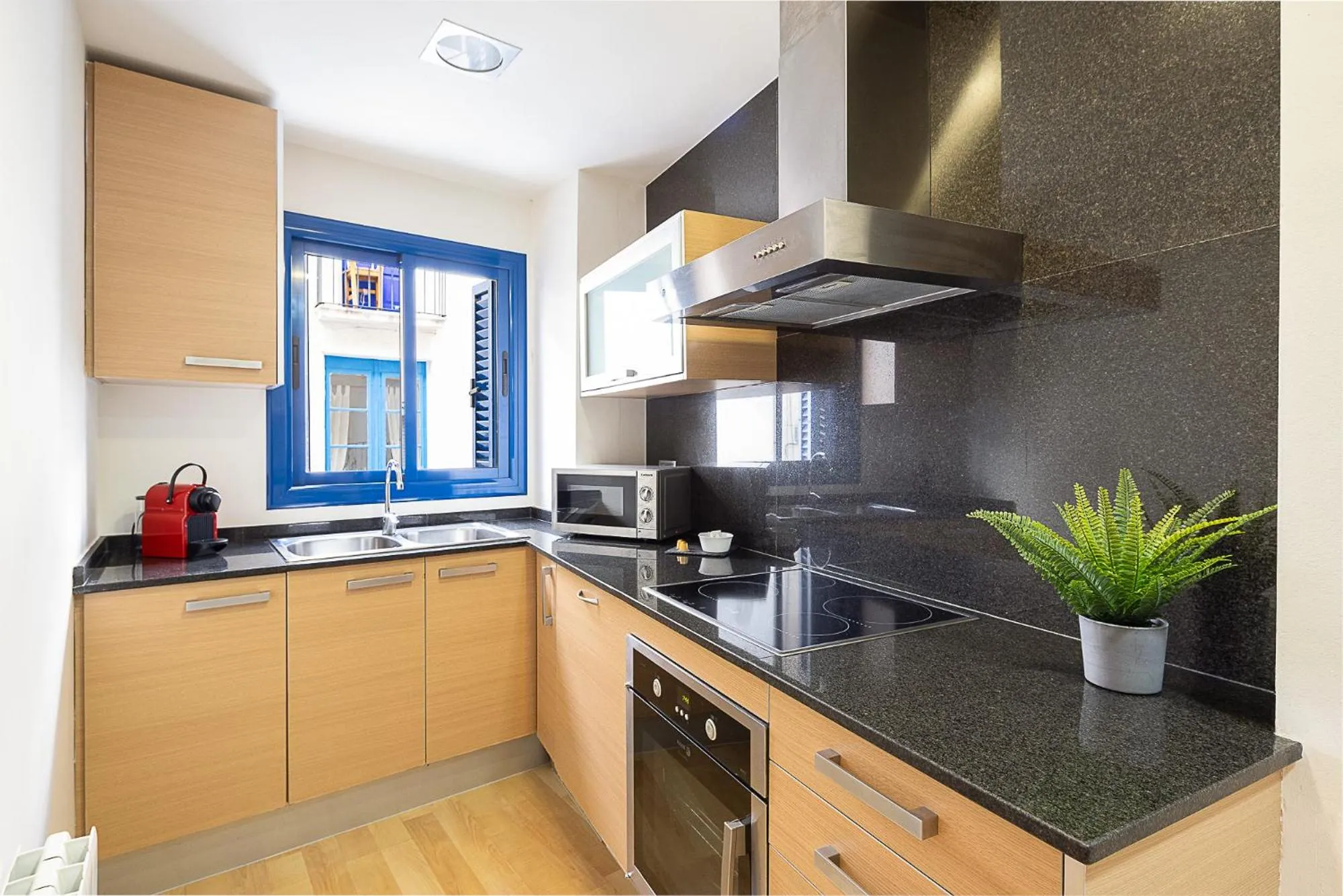 Kitchen or kitchenette in Lucas House Apartments by Sitges Group