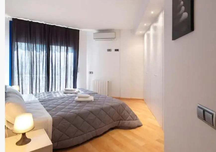 Bed in Lucas House Apartments by Sitges Group