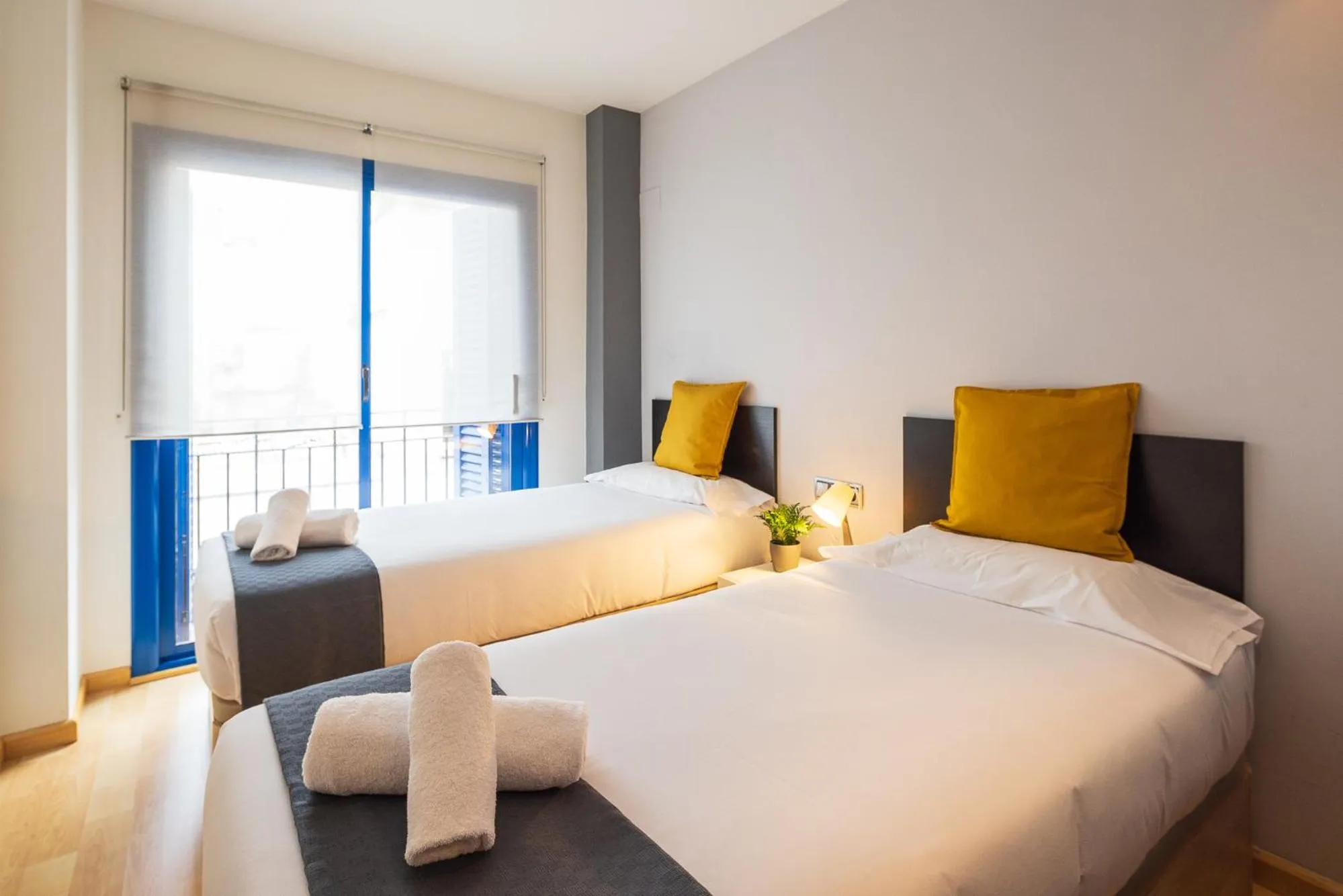 Bed in Lucas House Apartments by Sitges Group