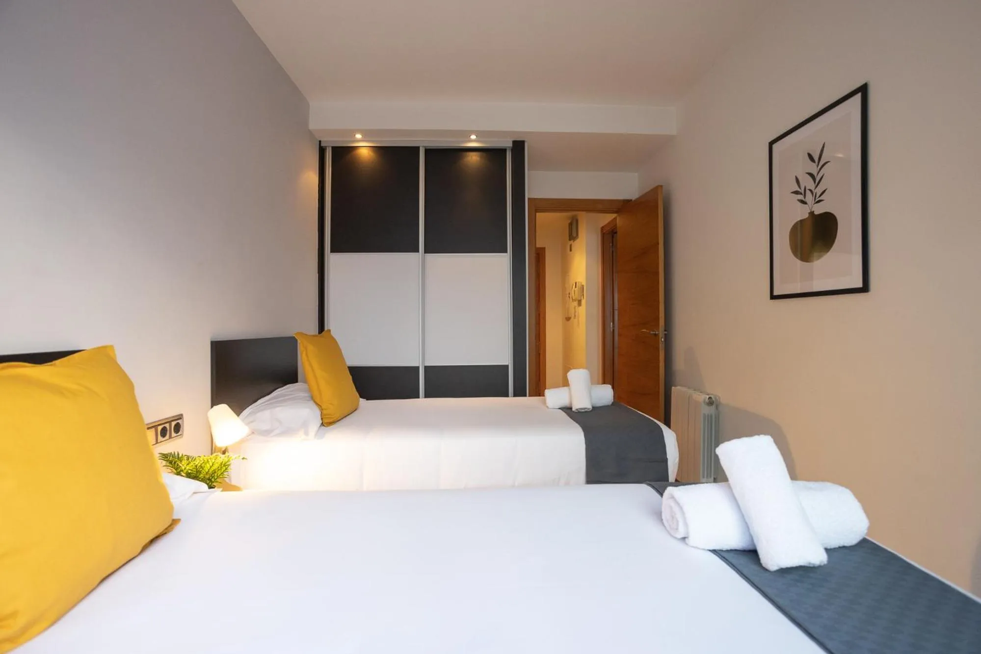Bed in Lucas House Apartments by Sitges Group