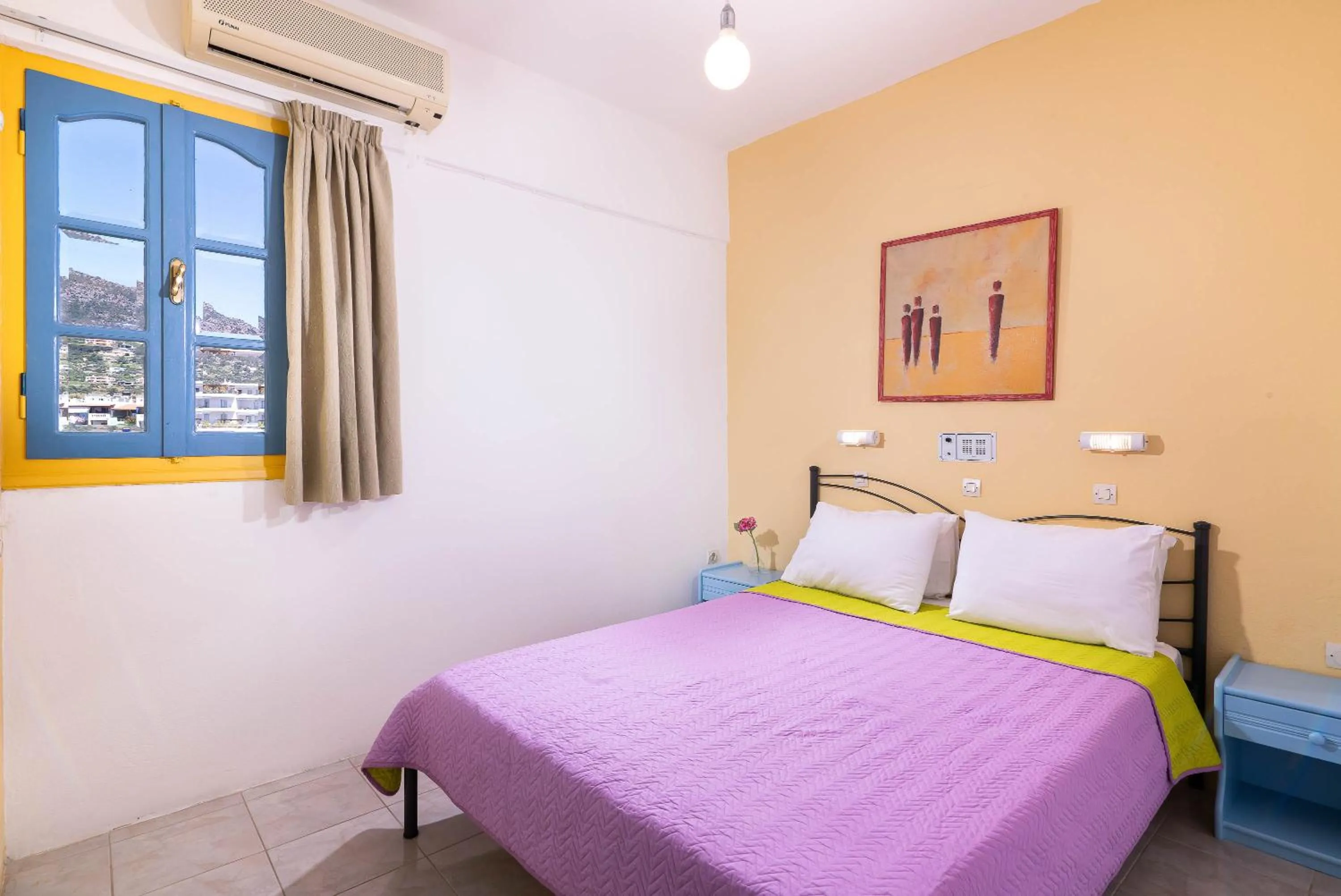 Bed in Afroditi Apartments