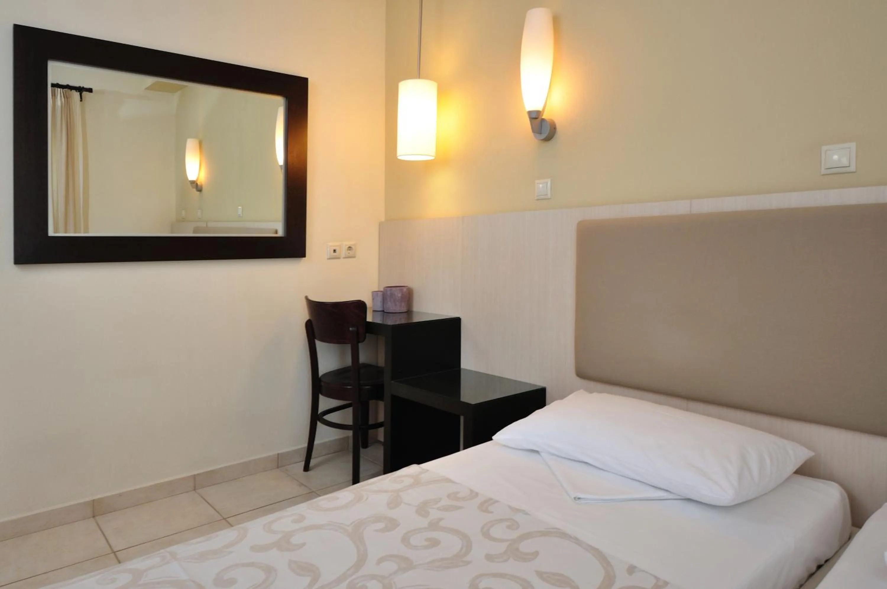 Bed in Louloudis Boutique Hotel