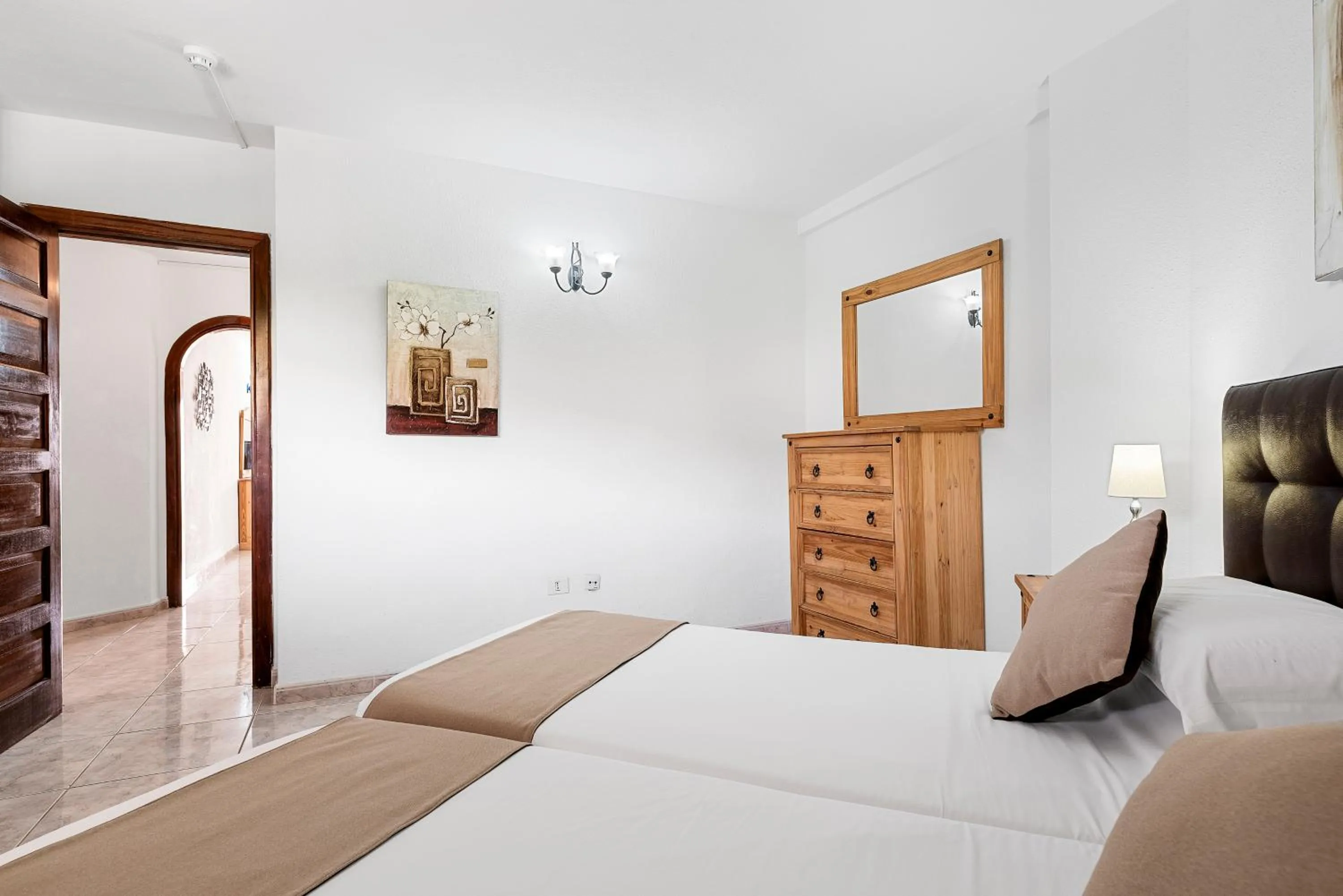 Bed in Paloma Beach Apartments