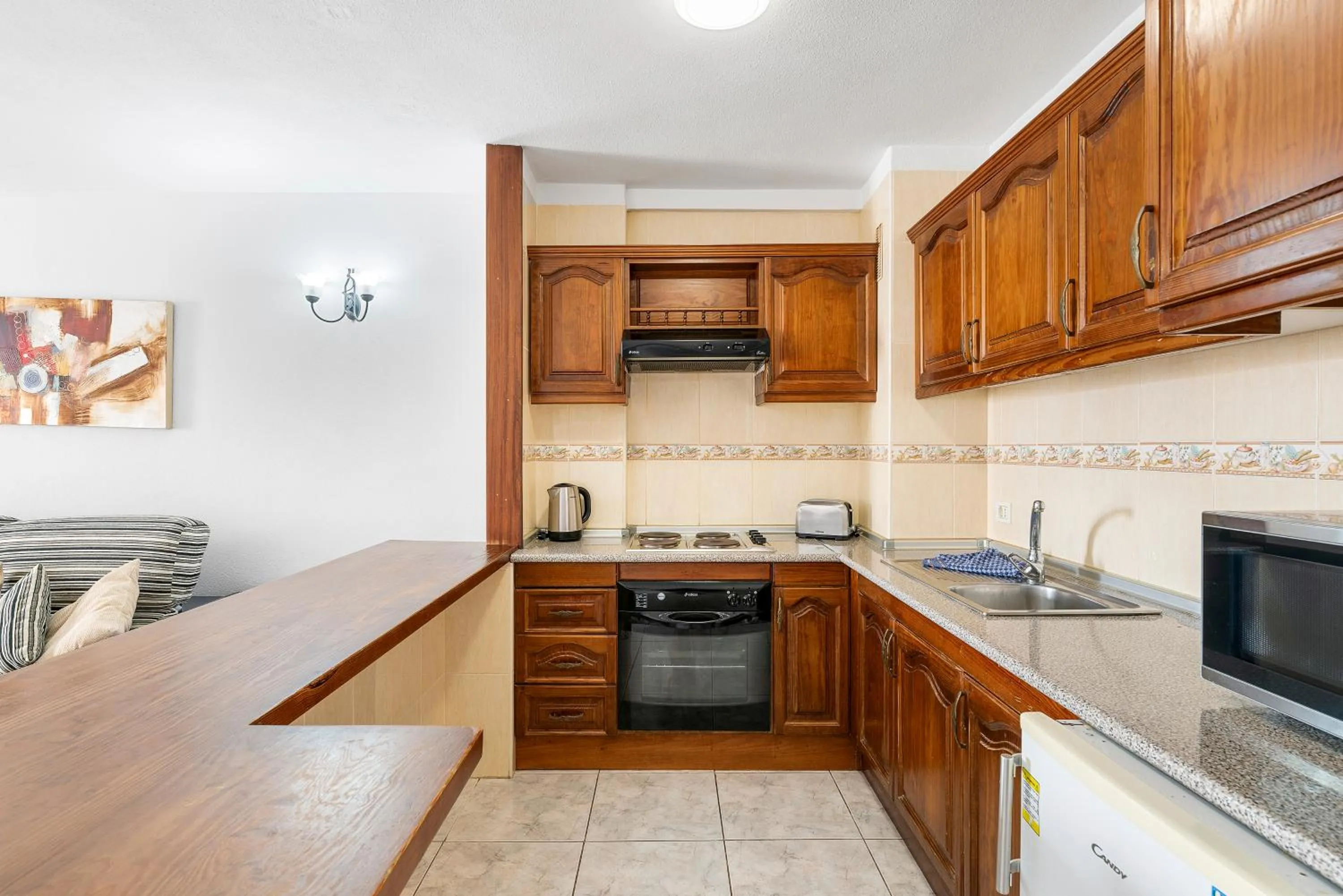 Kitchen or kitchenette in Paloma Beach Apartments