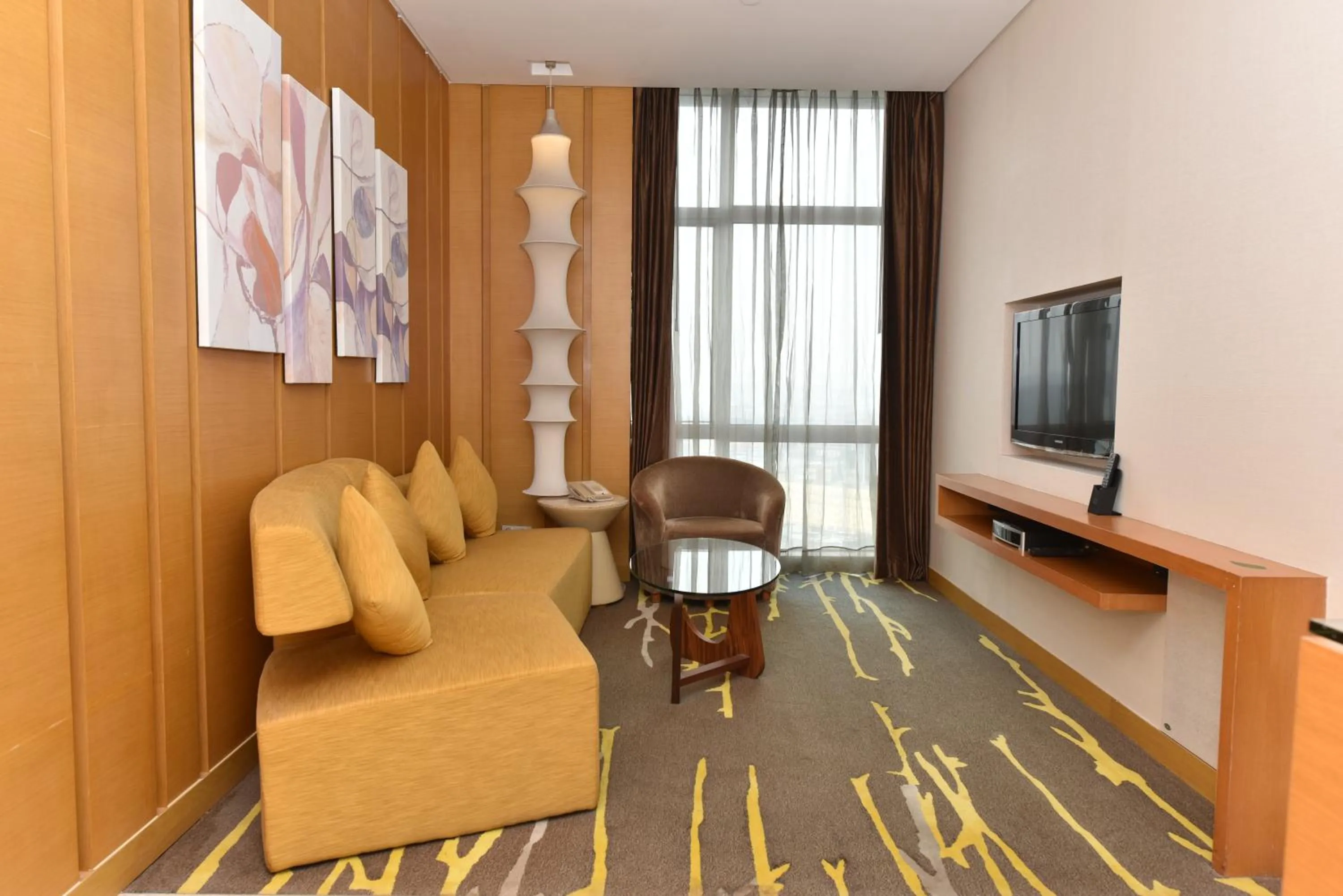 Living room in Crowne Plaza Zhongshan Wing On City by IHG