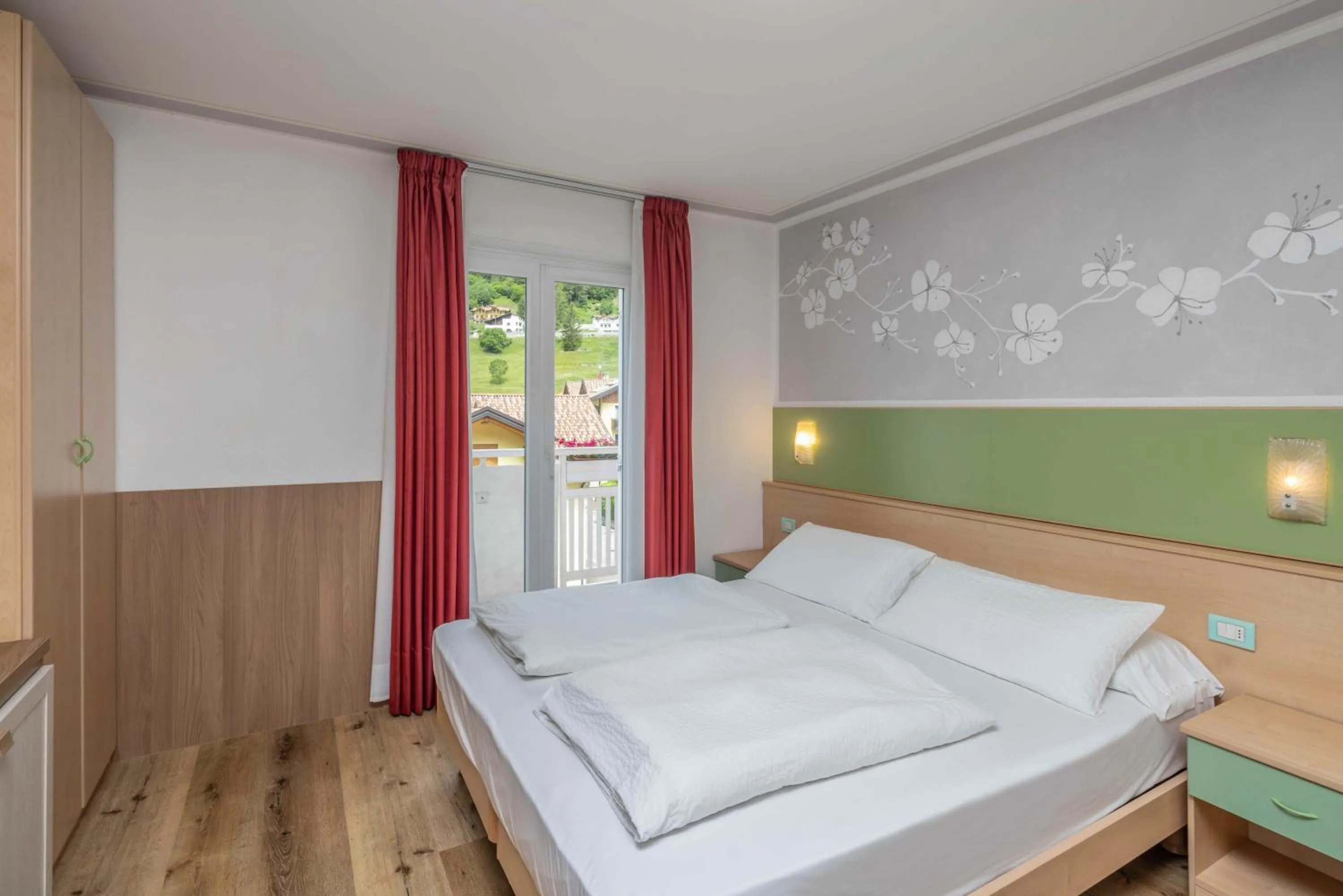 Bed in Hotel Londra Slow Living Molveno