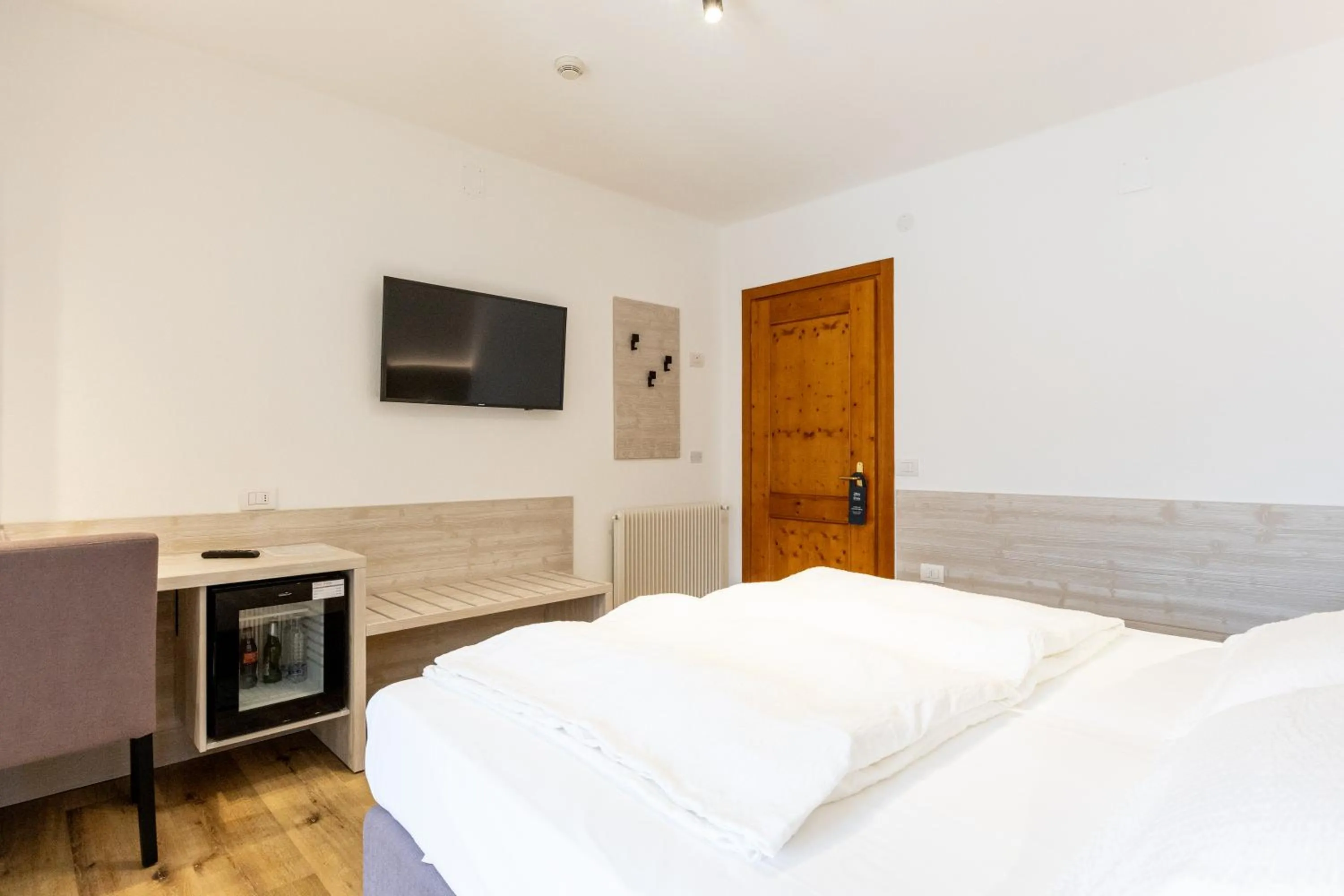 Bed in Hotel Londra Slow Living Molveno
