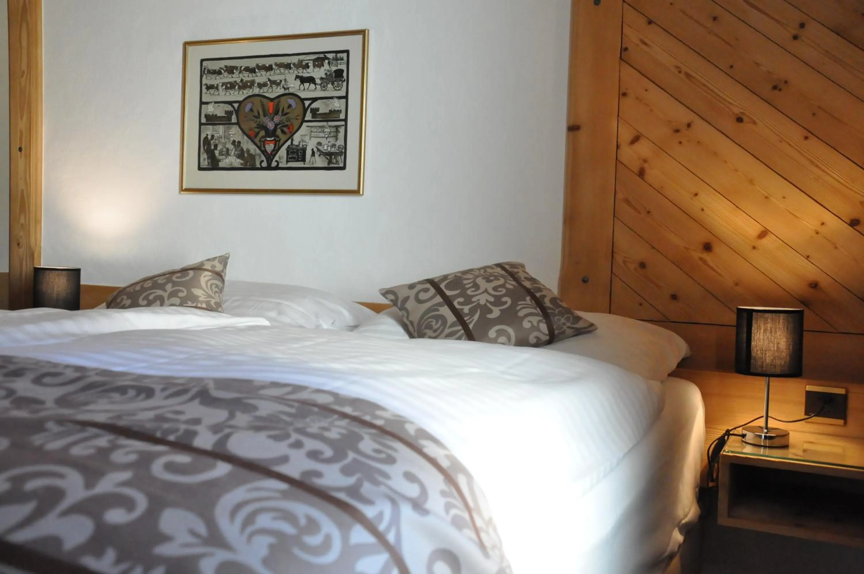 Bed in Résidence le Sapin & Bains de la Gruyère