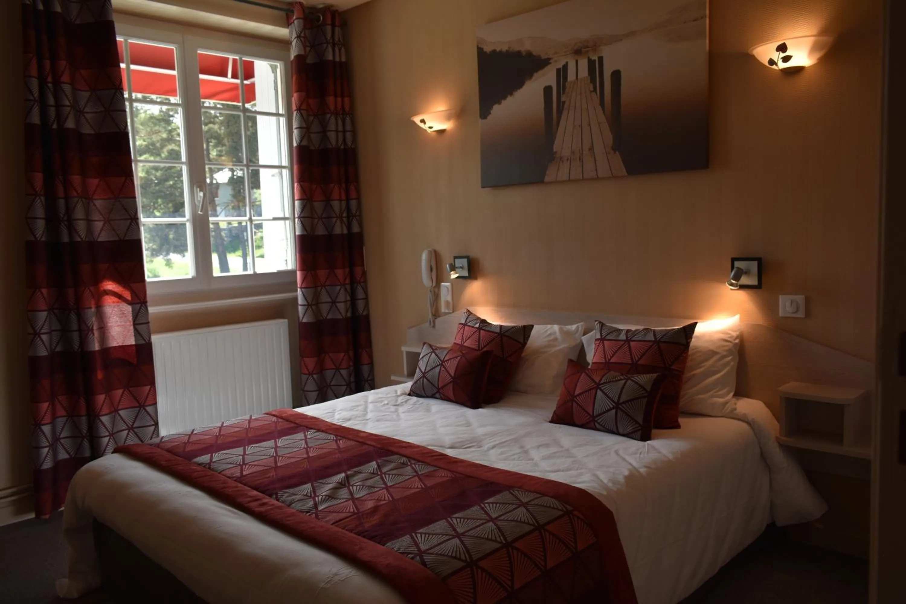 Bedroom in Logis Hôtel Beau Site